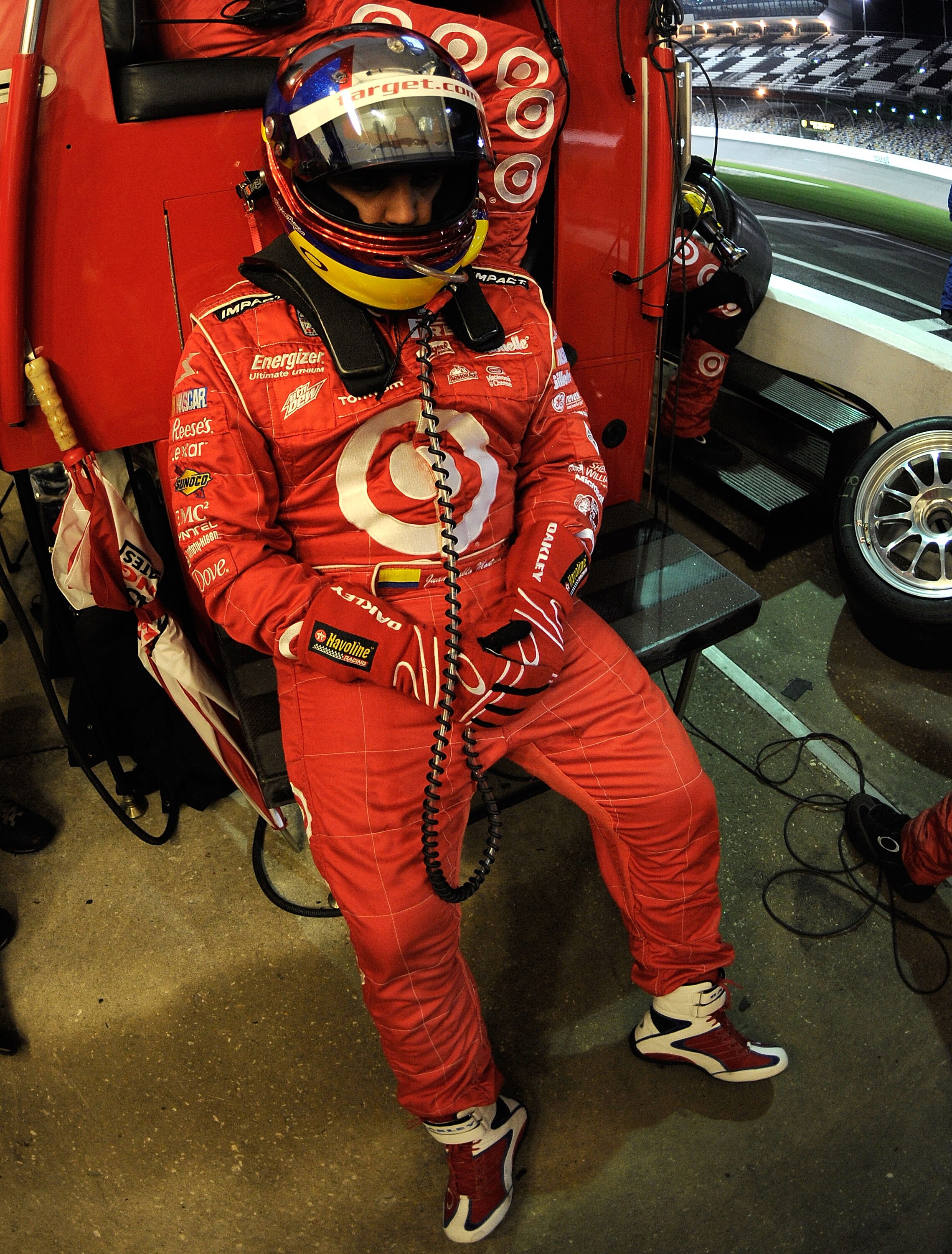 DAYTONA BEACH, FL - JANUARY 30:  Juan Pablo Montoya, driver of the #02 Target/TELMEX BMW Riley awaits his turn to drive during the Grand-Am Rolex 24 at Daytona held at Daytona International Speedway on January 30, 2010 in Daytona Beach, Florida.  (Photo b