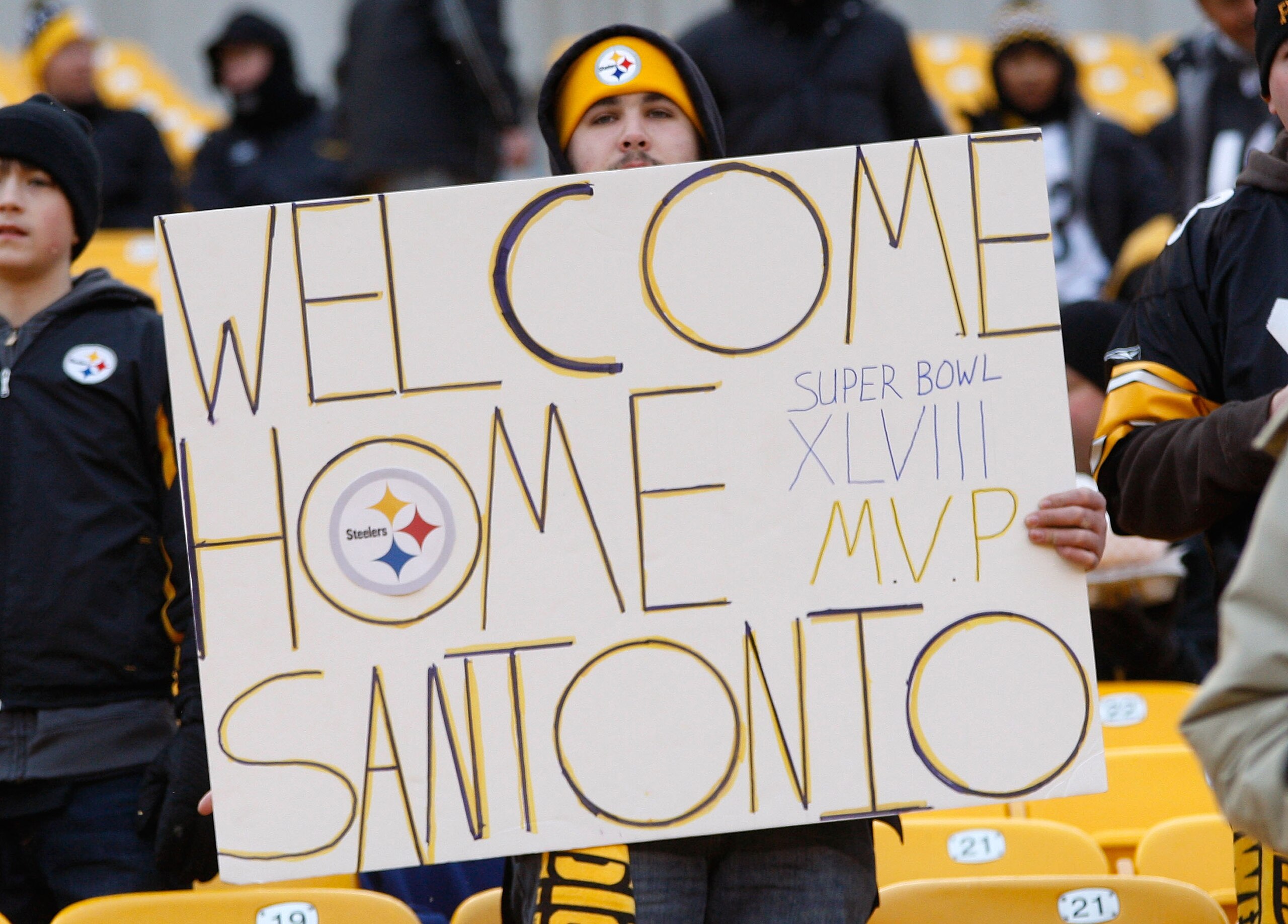 PITTSBURGH - DECEMBER 19:  A Pittsburgh Steelers fan holds up a sign welcoming back Santonio Holmes #10 of the New York Jets who was traded from the Pittsburgh Steelers during the offseason before the game on December 19, 2010 at Heinz Field in Pittsburgh