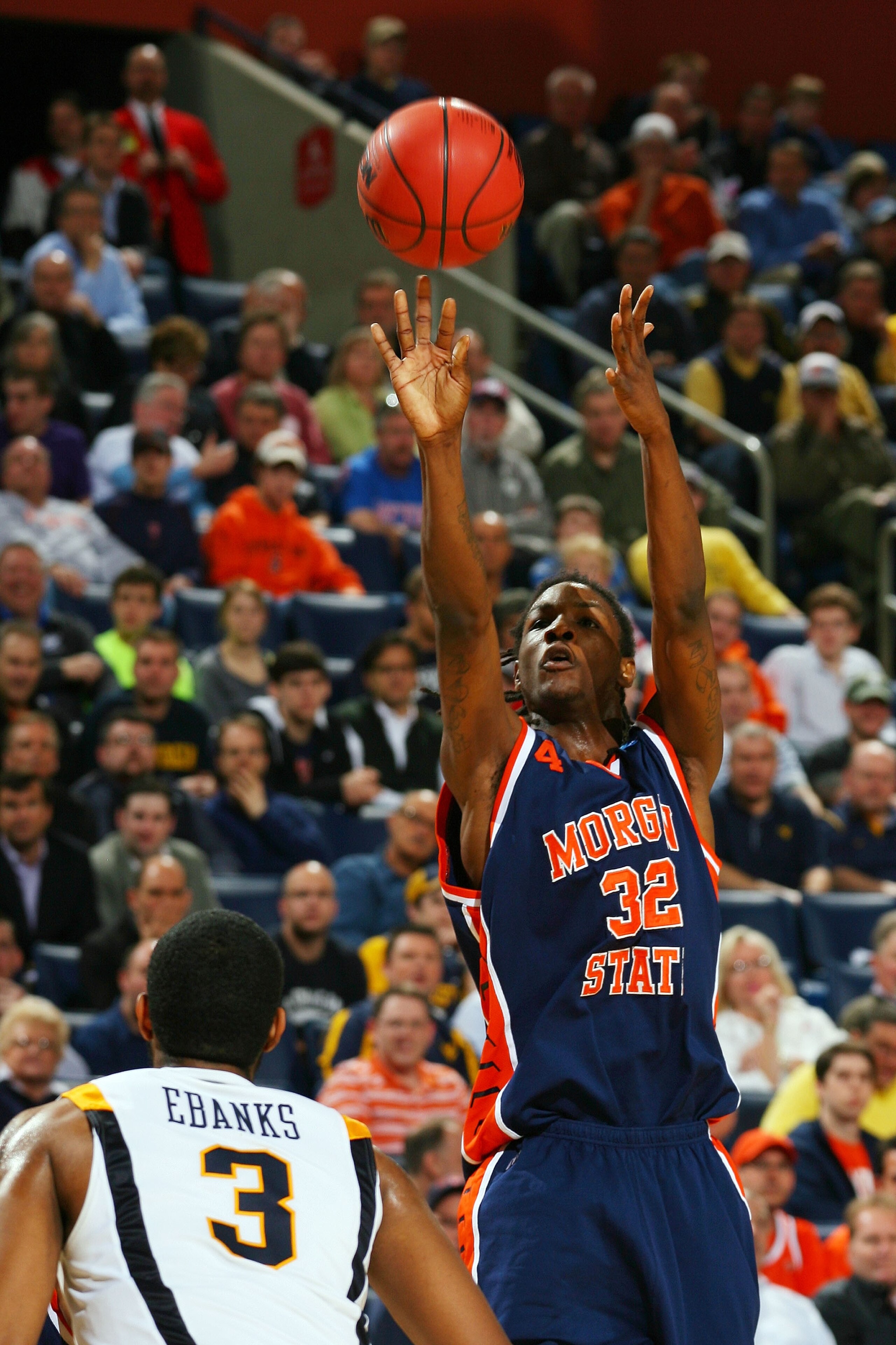 BUFFALO, NY - MARCH 19:  Dewayne Jackson #32 of the Morgan State Bears shoots against Devin Ebanks #3 of the West Virginia Mountaineers during the first round of the 2010 NCAA men's basketball tournament at HSBC Arena on March 19, 2010 in Buffalo, New Yor