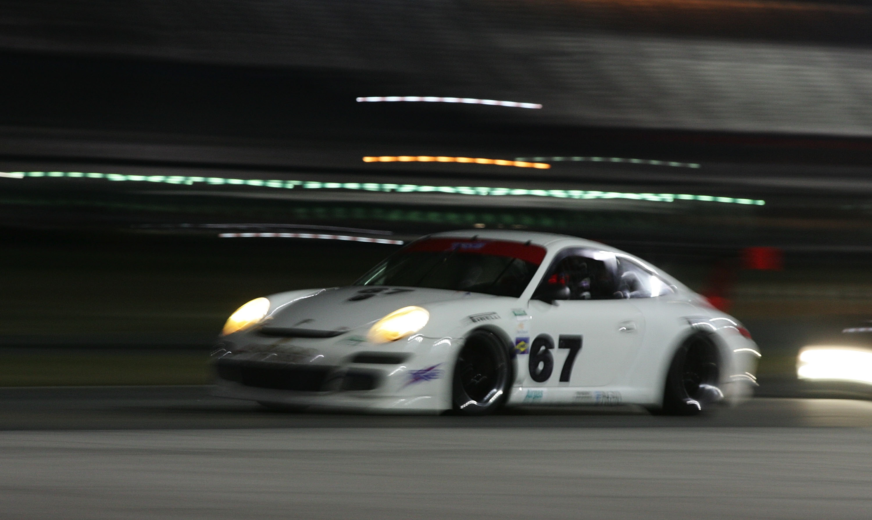 DAYTONA BEACH, FL - JANUARY 09:  The #67 Porsche of Jorg Bergneister, Patrick Long, Seth Neiman and Johannes van Over beek during Grand-Am Rolex Series testing at Daytona International Speedway on January 9, 2010 in Daytona Beach, Florida.  (Photo by Bria