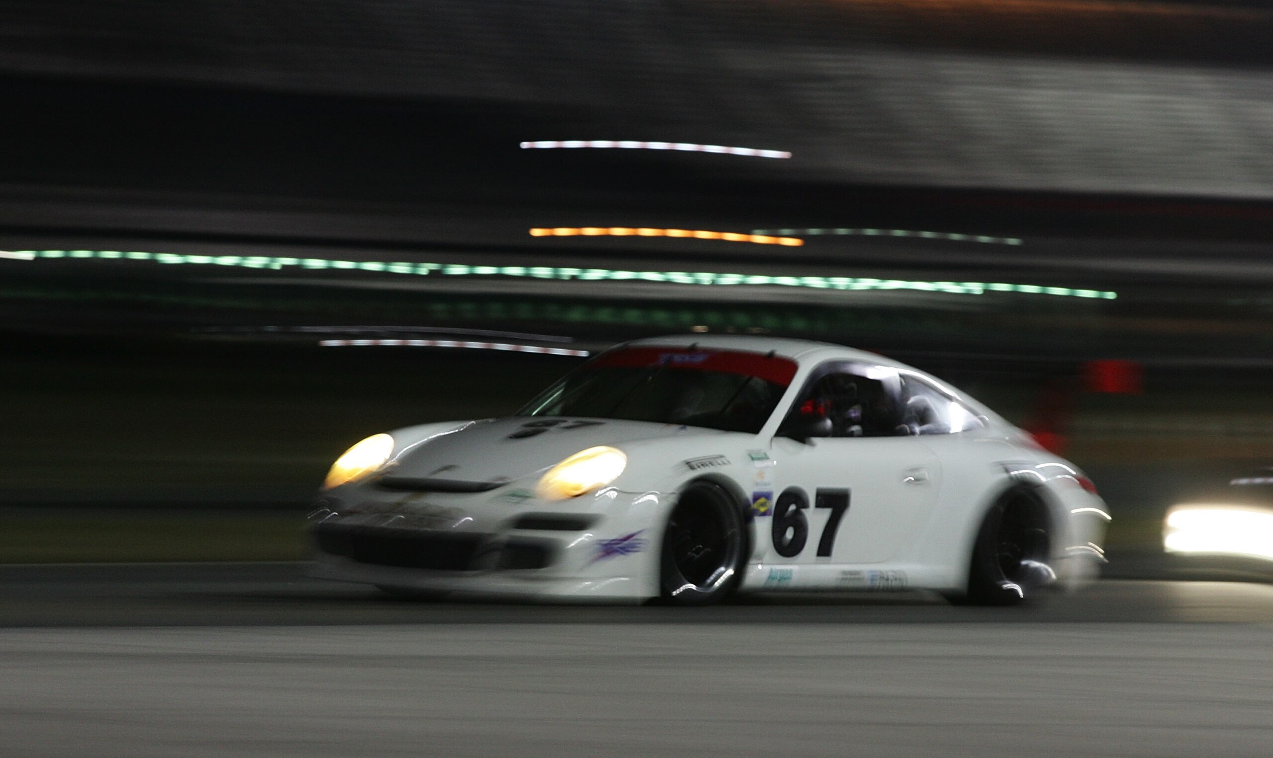 DAYTONA BEACH, FL - JANUARY 09: The #67 Porsche of Jorg Bergneister, Patrick Long, Seth Neiman and Johannes van Over beek during Grand-Am Rolex Series testing at Daytona International Speedway on January 9, 2010 in Daytona Beach, Florida. (Photo by Bria DAYTONA BEACH, FL - JANUARY 09: The #67 Porsche of Jorg Bergneister, Patrick Long, Seth Neiman and Johannes van Over beek during Grand-Am Rolex Series testing at Daytona International Speedway on January 9, 2010 in Daytona Beach, Florida. (Photo by Bria