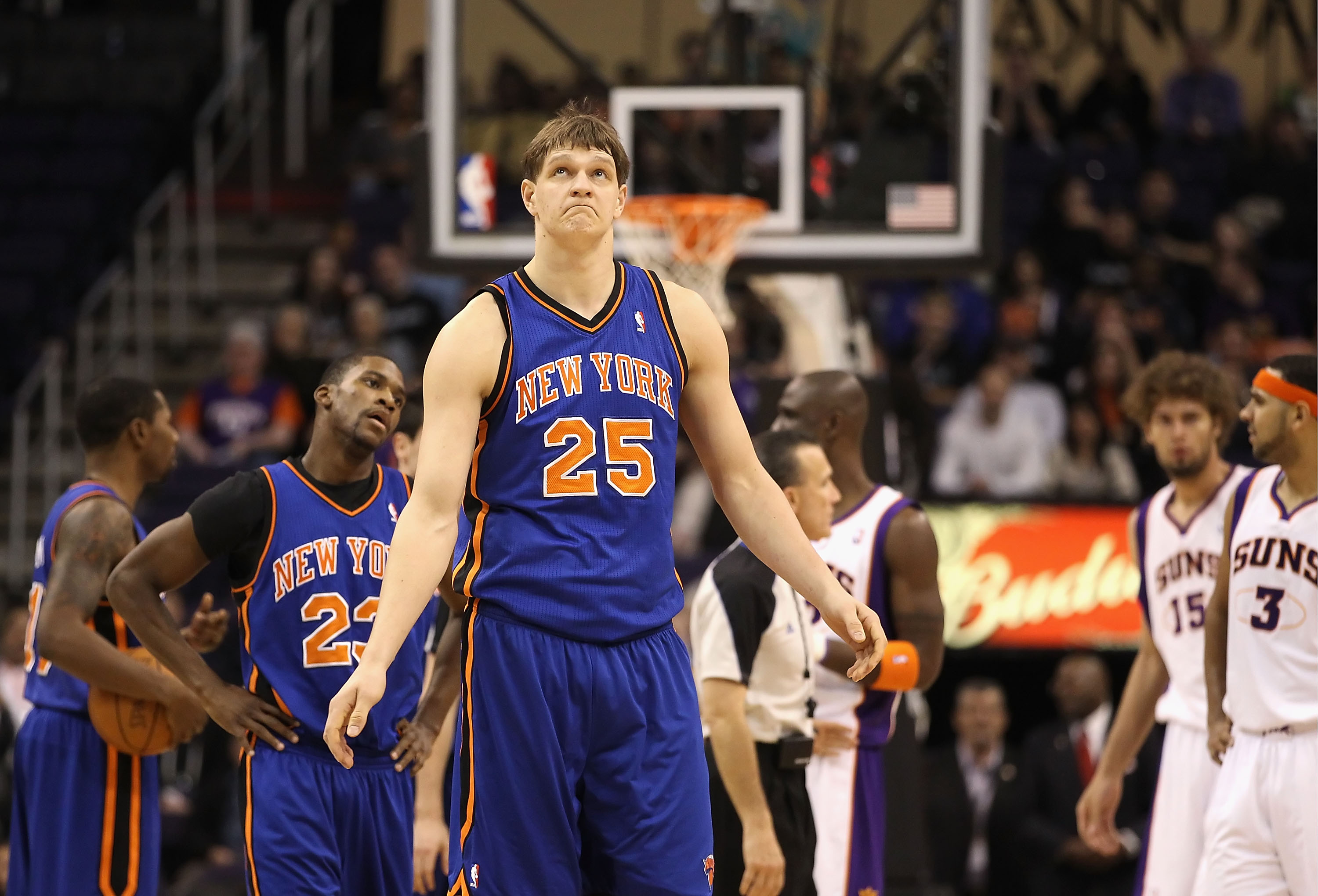 PHOENIX - JANUARY 07:  Timofey Mozgov #25 of the New York Knicks walks off the court after being ejected from the NBA game for an elbow against Robin Lopez #15 of the Phoenix Suns at US Airways Center on January 7, 2011 in Phoenix, Arizona.  The Knicks de
