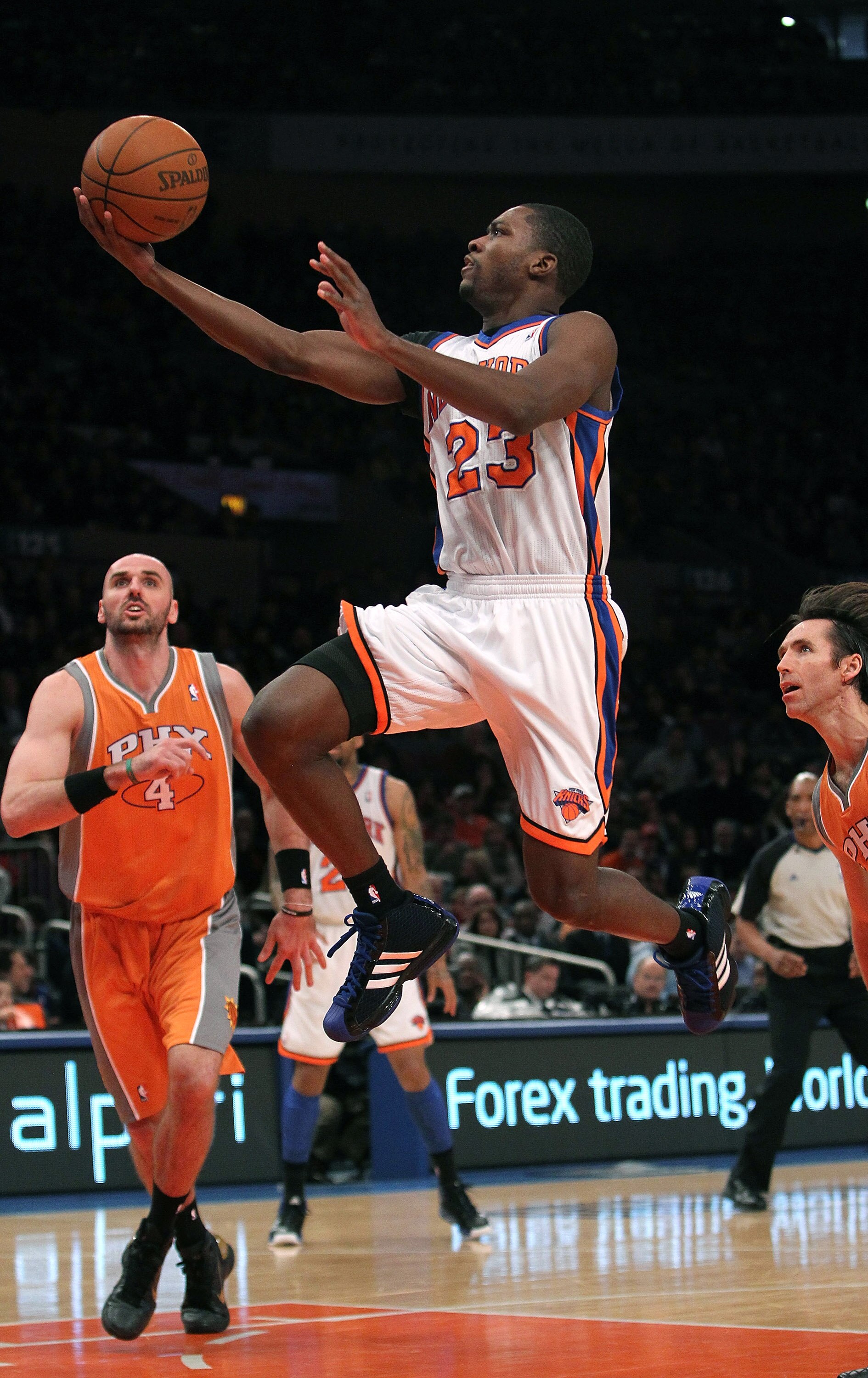 NEW YORK, NY - JANUARY 17:  Toney Douglas #23 of the New York Knicks lays the ball up against the Phoenix Suns at Madison Square Garden on January 17, 2011 in New York City. NOTE TO USER: User expressly acknowledges and agrees that, by downloading and or