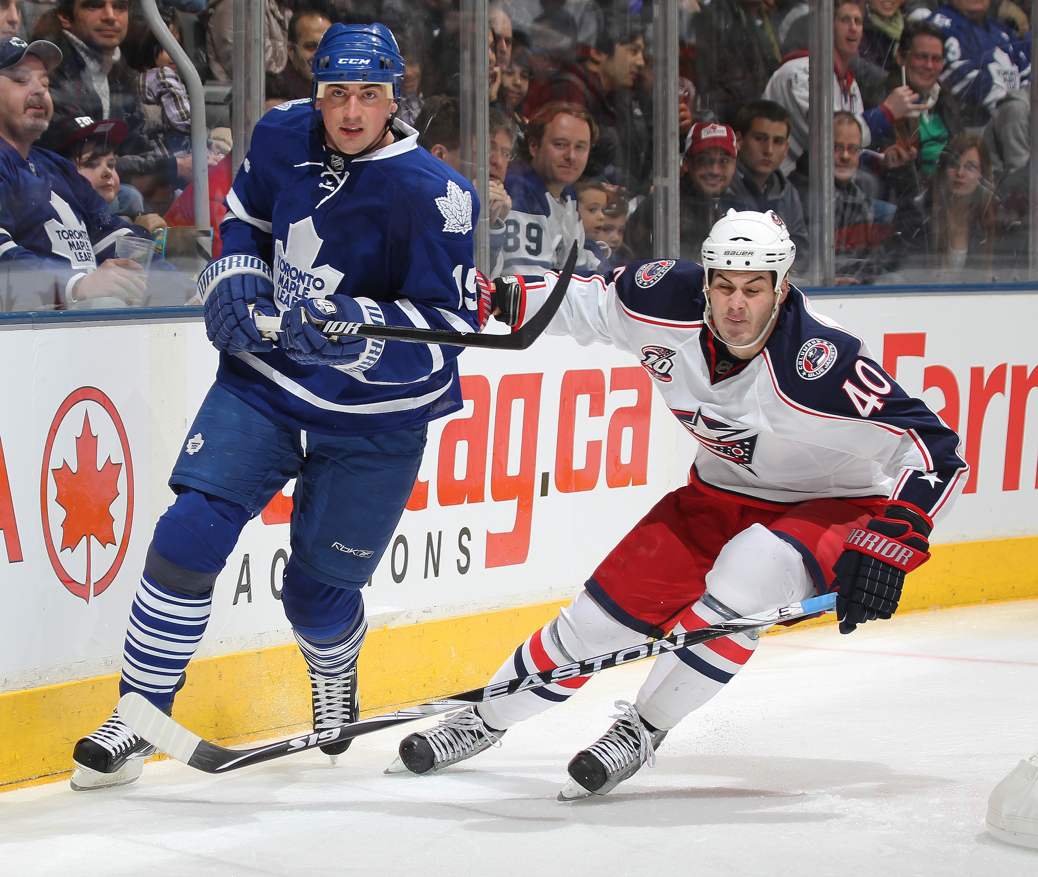 TORONTO,CAN - DECEMBER 30: Jared Boll #40 of the Columbus Blue Jackets tries to get to Tomas Kaberle #15 of the Toronto Maple Leafs before he can clear the puck in a game on December 30, 2010 at the Air Canada Centre in Toronto, Canada. (Photo by Claus A TORONTO,CAN - DECEMBER 30: Jared Boll #40 of the Columbus Blue Jackets tries to get to Tomas Kaberle #15 of the Toronto Maple Leafs before he can clear the puck in a game on December 30, 2010 at the Air Canada Centre in Toronto, Canada. (Photo by Claus A
