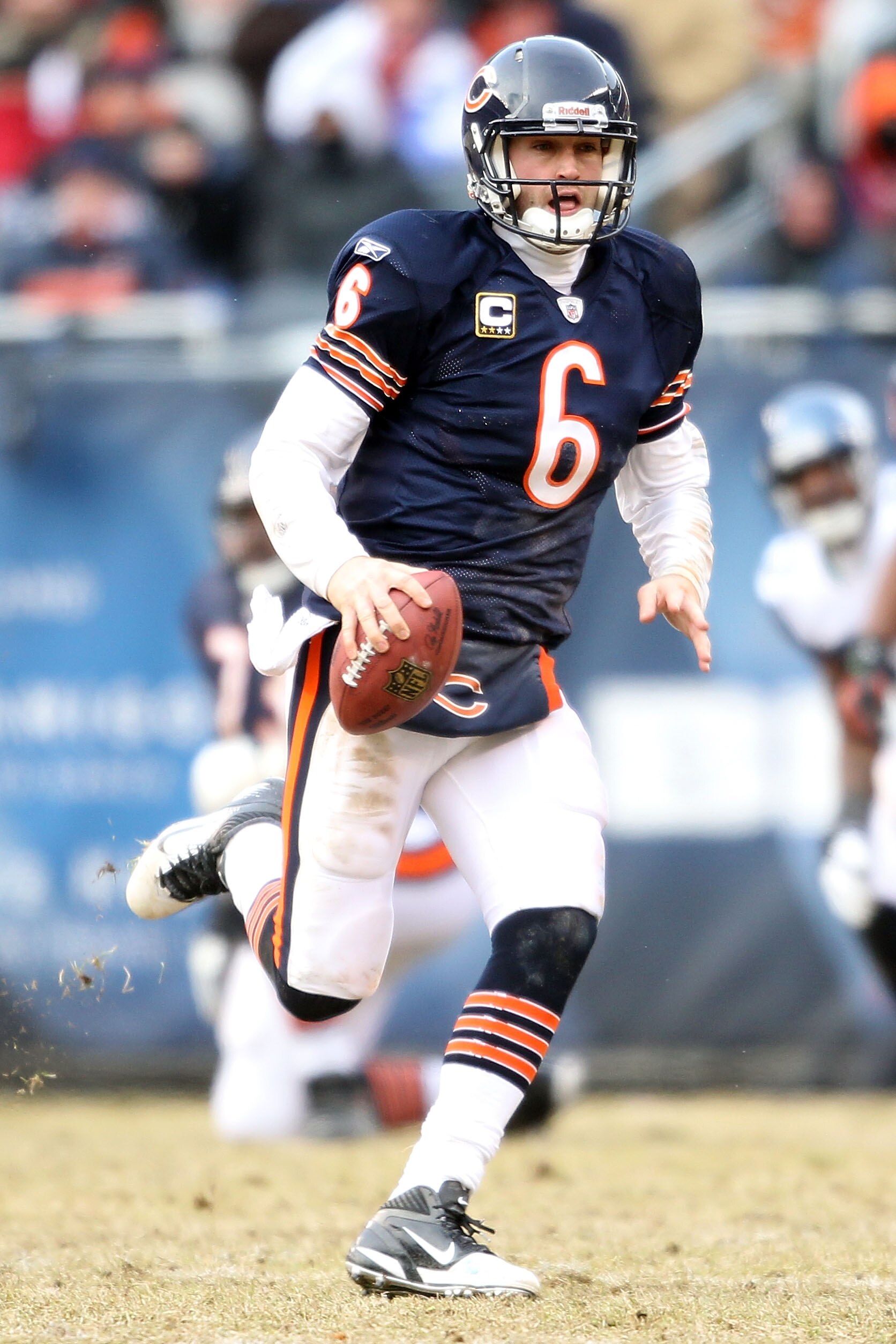 CHICAGO, IL - JANUARY 16:  Quarterback Jay Cutler #6 of the Chicago Bears runs the ball against the Seattle Seahawks in the second quarter of the 2011 NFC divisional playoff game at Soldier Field on January 16, 2011 in Chicago, Illinois.  (Photo by Andy L