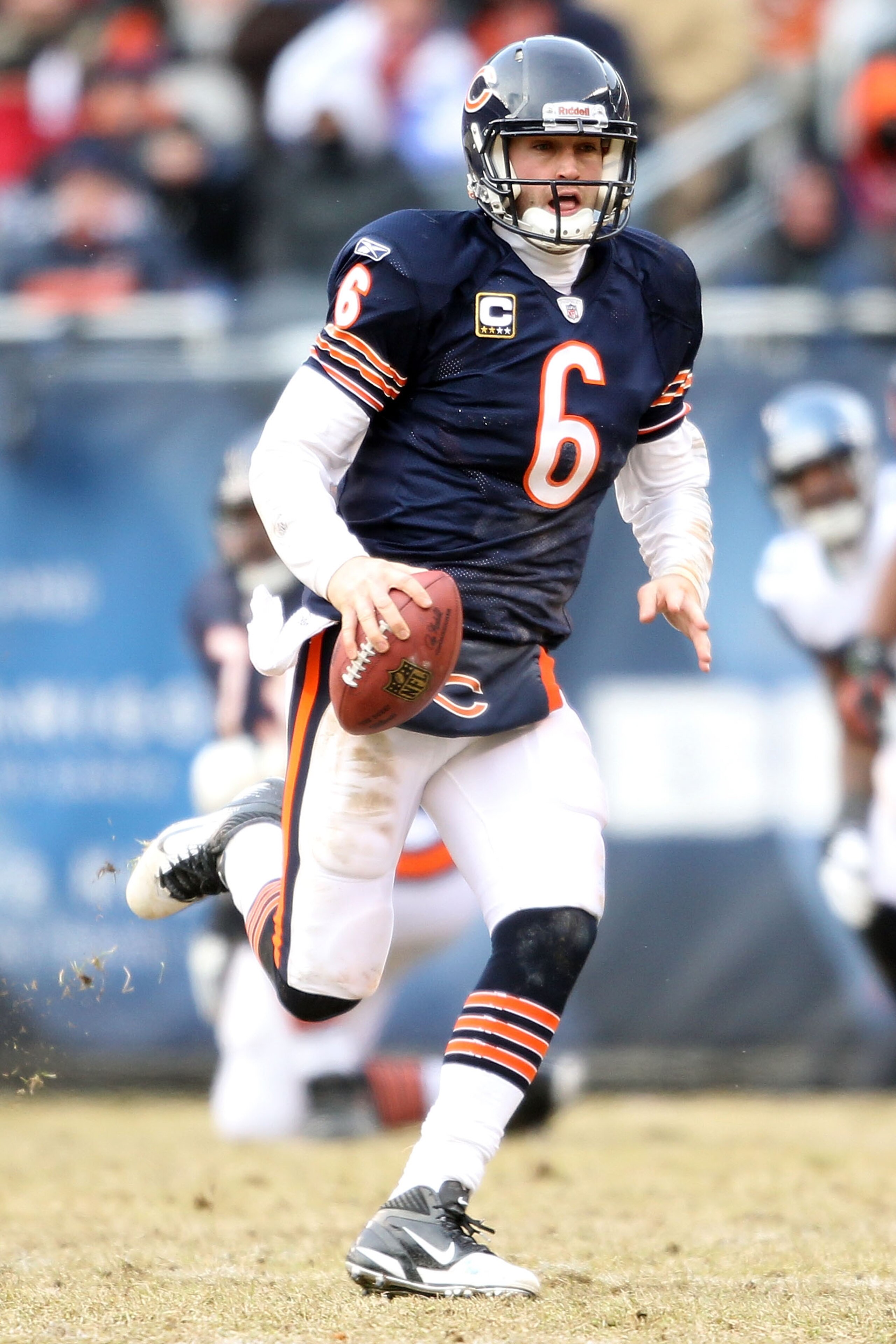 CHICAGO, IL - JANUARY 16:  Quarterback Jay Cutler #6 of the Chicago Bears runs the ball against the Seattle Seahawks in the second quarter of the 2011 NFC divisional playoff game at Soldier Field on January 16, 2011 in Chicago, Illinois.  (Photo by Andy L