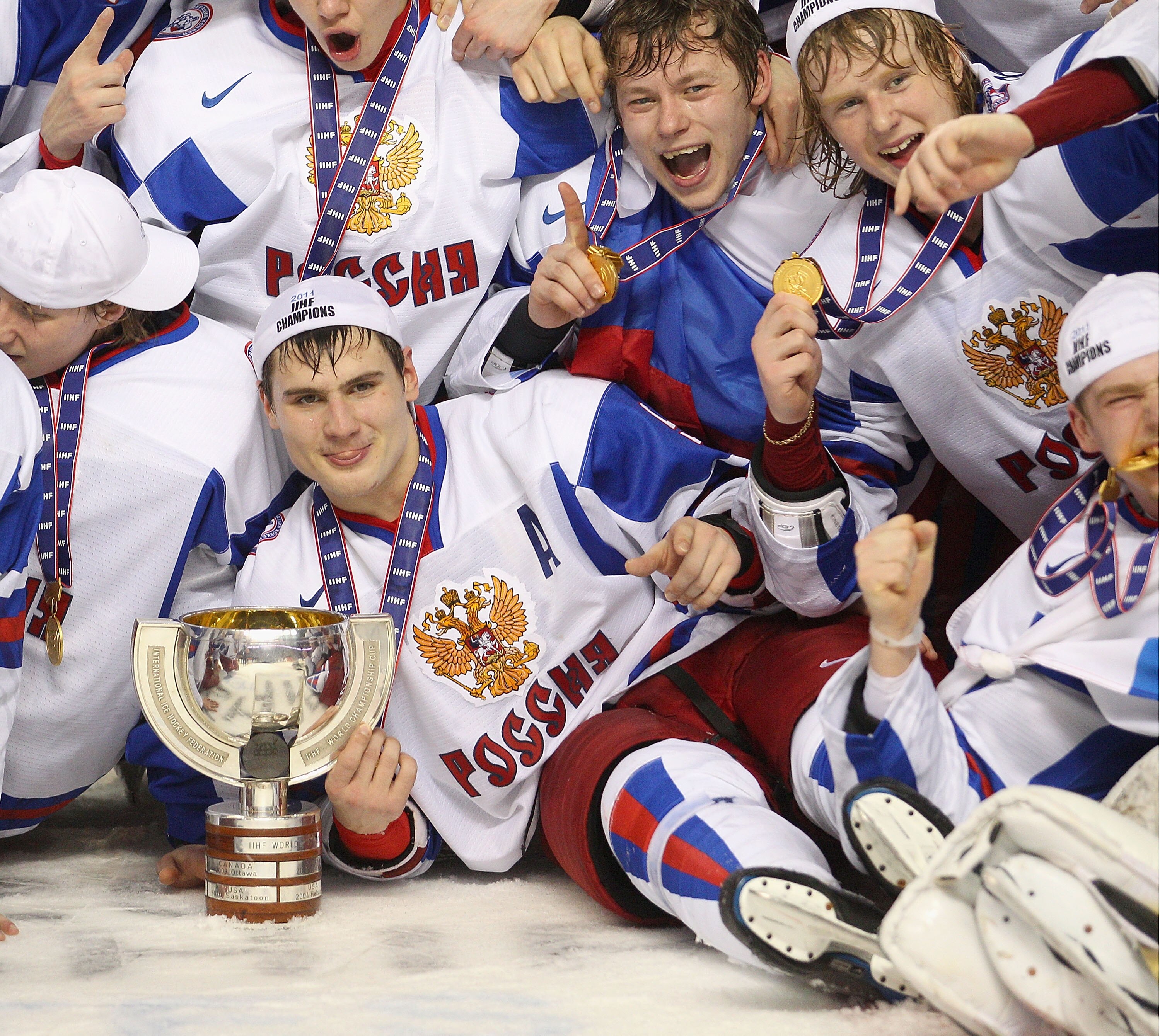 BUFFALO, NY - JANUARY 05: Dmitri Orlov #9 of Russia touches the trophy for winning the 2011 IIHF World U20 Championship Gold medal against Canada after defeating Canada 5-3 at the HSBC Arena on January 5, 2011 in Buffalo, New York.  (Photo by Rick Stewart
