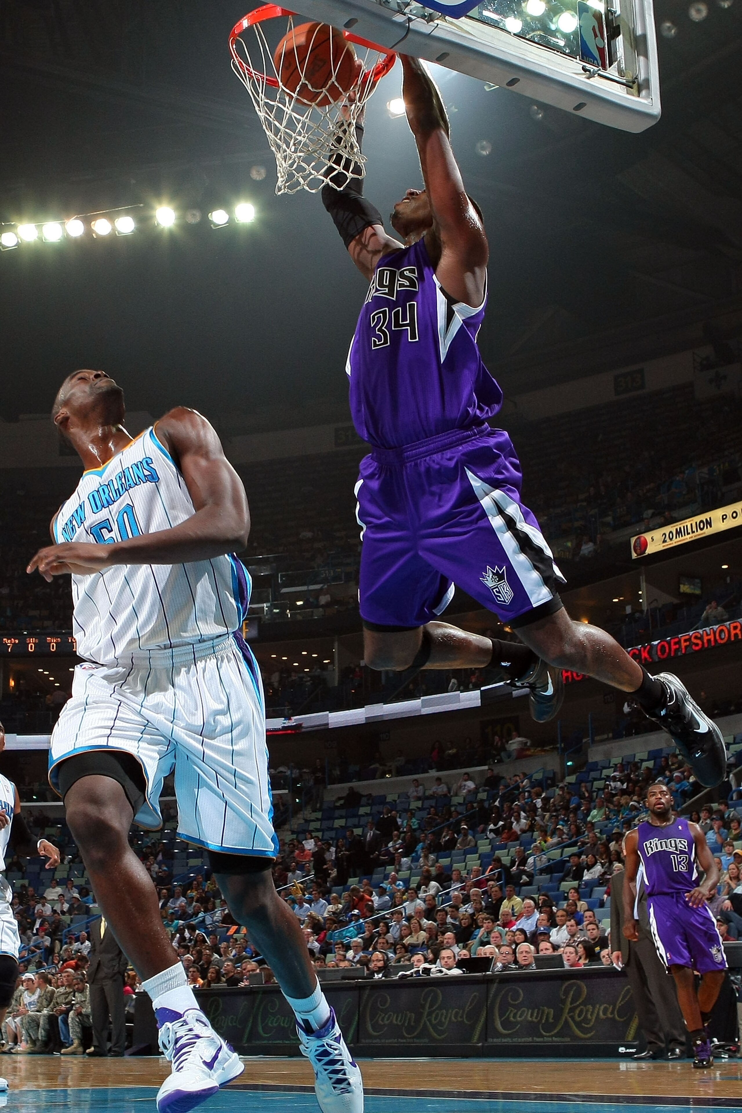 NEW ORLEANS, LA - DECEMBER 15: Jason Thompson #34 of the Sacramento Kings dunks the ball over Emeka Okafor #50 of the New Orleans Hornets at the New Orleans Arena on December 15, 2010 in New Orleans, Louisiana. NOTE TO USER: User expressly acknowledges NEW ORLEANS, LA - DECEMBER 15: Jason Thompson #34 of the Sacramento Kings dunks the ball over Emeka Okafor #50 of the New Orleans Hornets at the New Orleans Arena on December 15, 2010 in New Orleans, Louisiana. NOTE TO USER: User expressly acknowledges