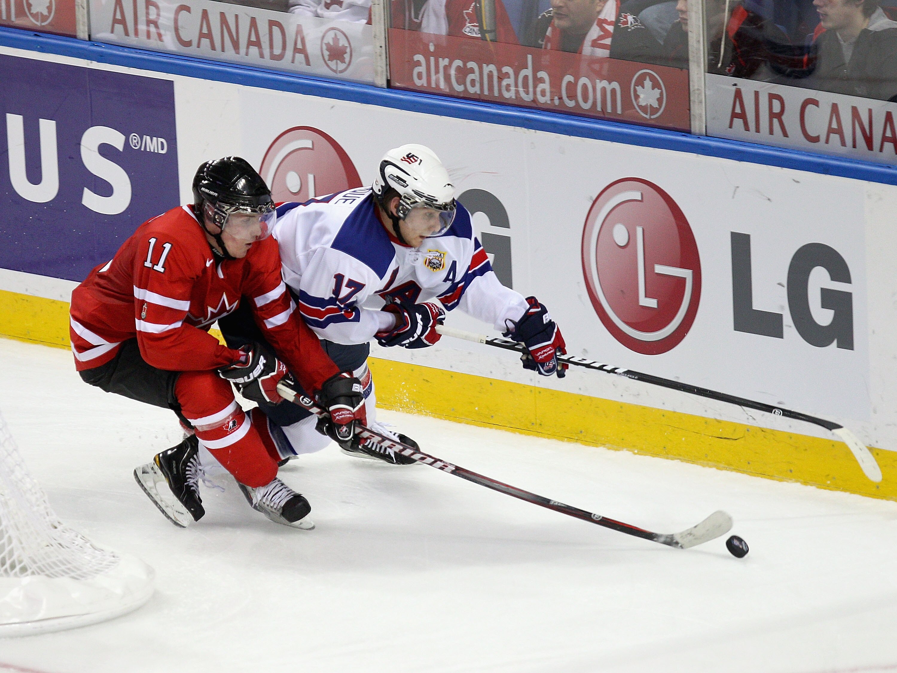 BUFFALO, NY - JANUARY 03:  Ryan Bourque #17  of the United States skates against Casey Cizikas #11 of Canada during the 2011 IIHF World U20 Championship Semi Final game between United States and Canada on January 3, 2011 in Buffalo, New York.  (Photo by R