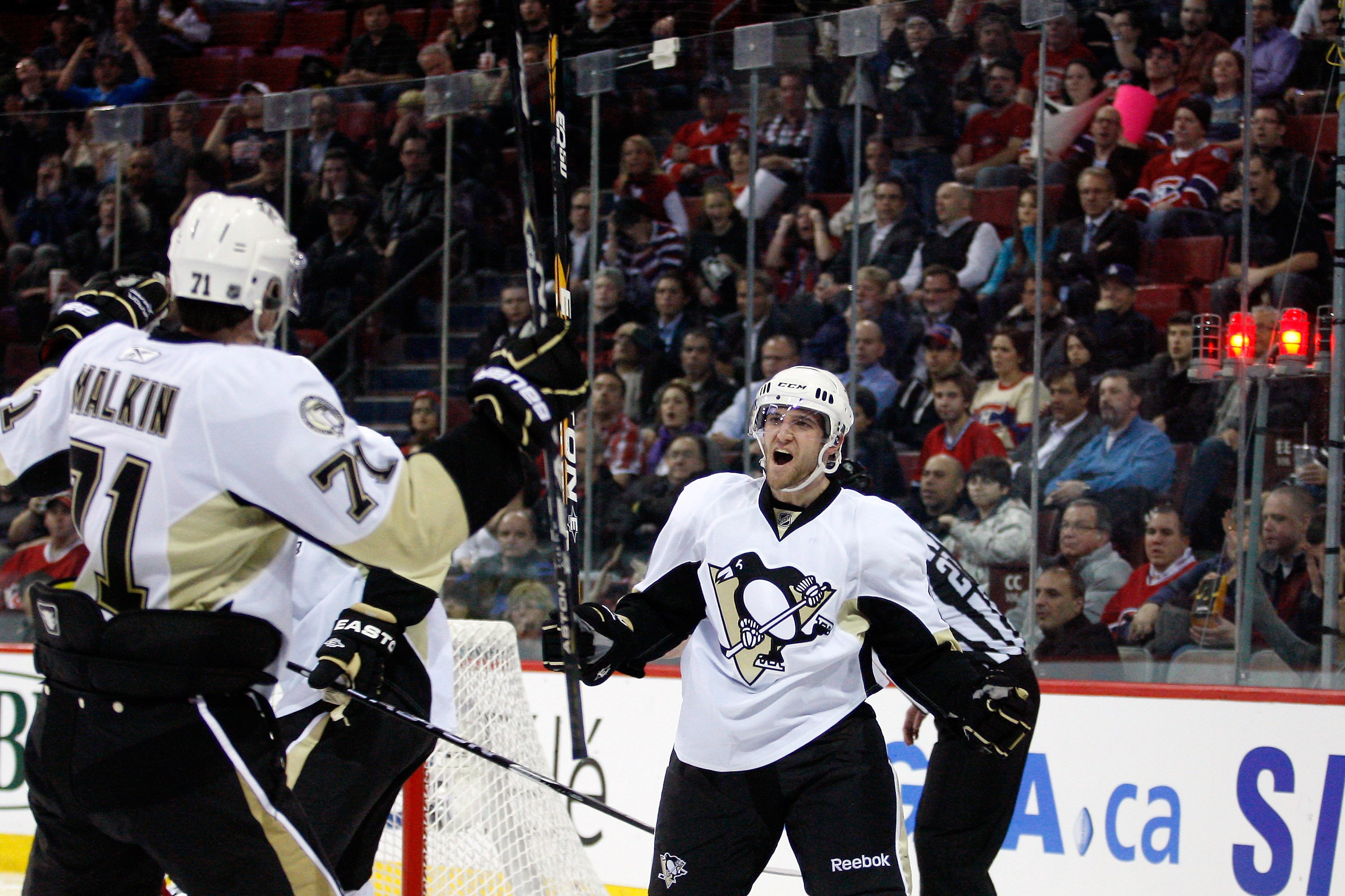 MONTREAL, CANADA - JANUARY 12: Alex Goligoski #3 of the Pittsburgh Penguins celebrates his third period goal with team mate Evgeni Malkin #71 during the NHL game against the Montreal Canadiens at the Bell Centre on January 12, 2011 in Montreal, Quebec, C MONTREAL, CANADA - JANUARY 12: Alex Goligoski #3 of the Pittsburgh Penguins celebrates his third period goal with team mate Evgeni Malkin #71 during the NHL game against the Montreal Canadiens at the Bell Centre on January 12, 2011 in Montreal, Quebec, C