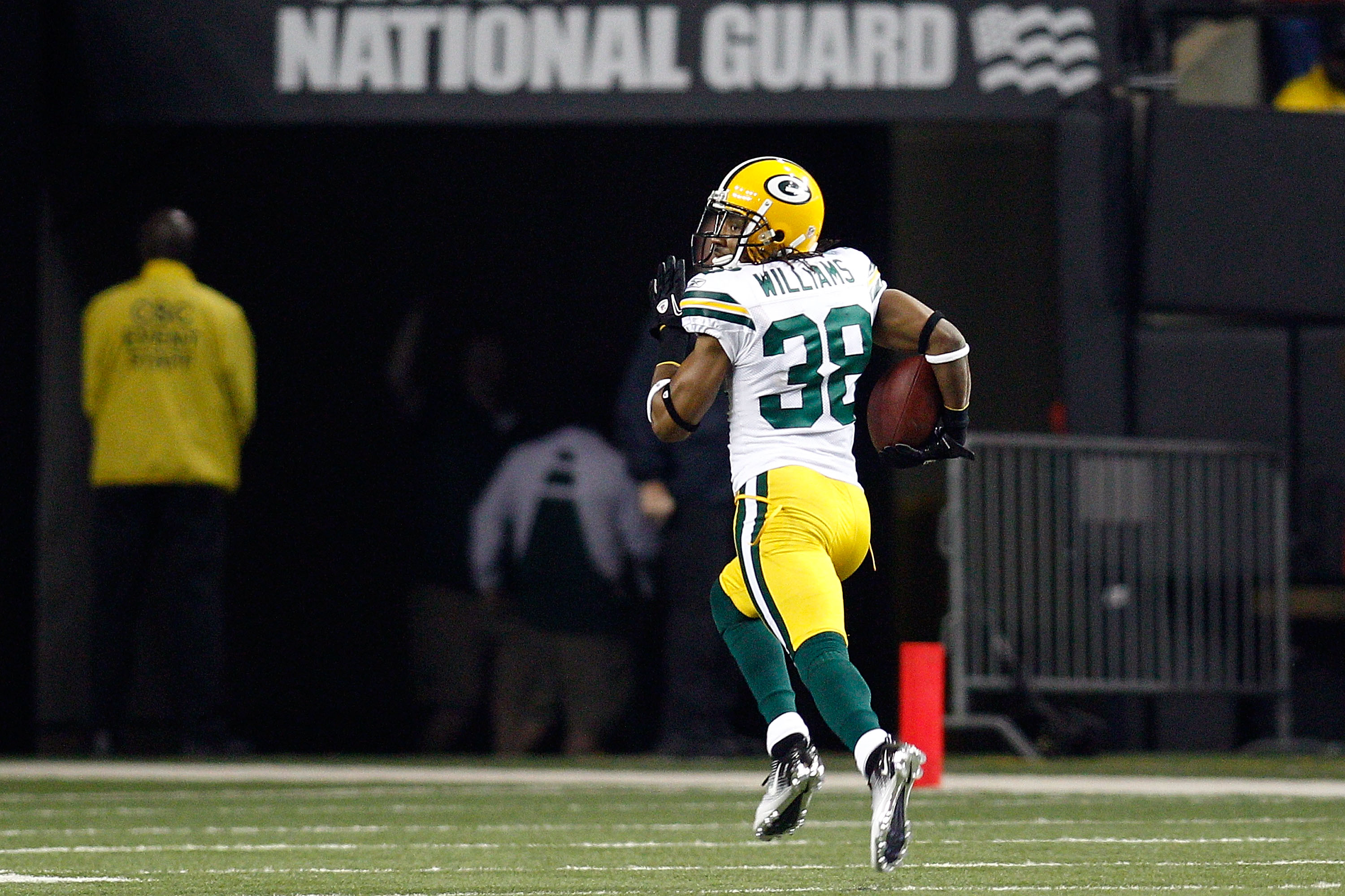 ATLANTA, GA - JANUARY 15:  Tramon Williams ##8 of the Green Bay Packers returns an interception 70-yards for a touchdown in the second quarter against the Atlanta Falcons during their 2011 NFC divisional playoff game at Georgia Dome on January 15, 2011 in