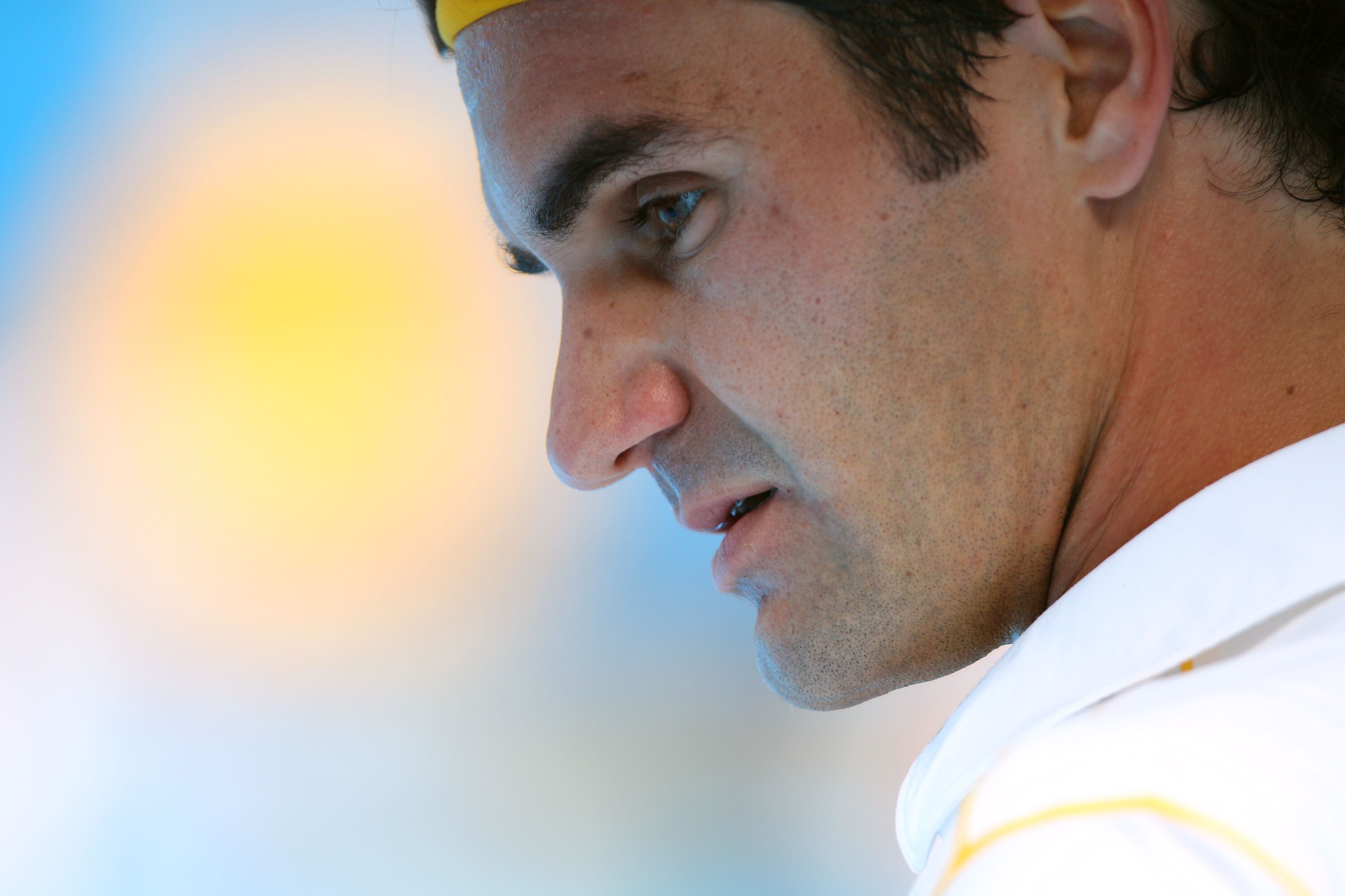 MELBOURNE, AUSTRALIA - JANUARY 17:  Roger Federer of Switzerland looks on between games in his first round match against Lukas Lacko of Slovakia during day one of the 2011 Australian Open at Melbourne Park on January 17, 2011 in Melbourne, Australia.  (Ph