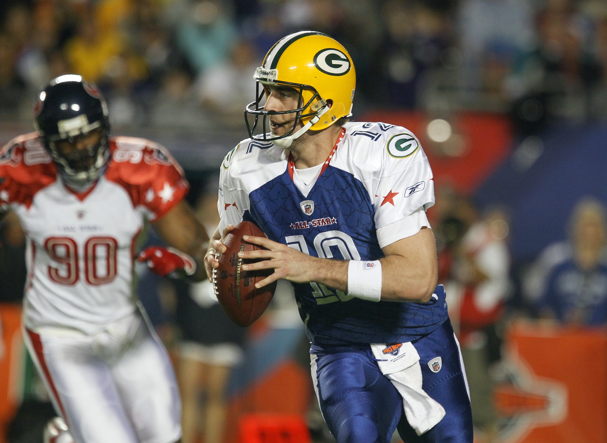 MIAMI GARDENS, FL - JANUARY 31:  Aaron Rodgers #12 of the NFC's Green Bay Packers looks to make a pass play during the 2010 AFC-NFC Pro Bowl game at Sun Life Stadium on January 31, 2010 in Miami Gardens, Florida. The AFC defeated the NFC 41-34. (Photo by