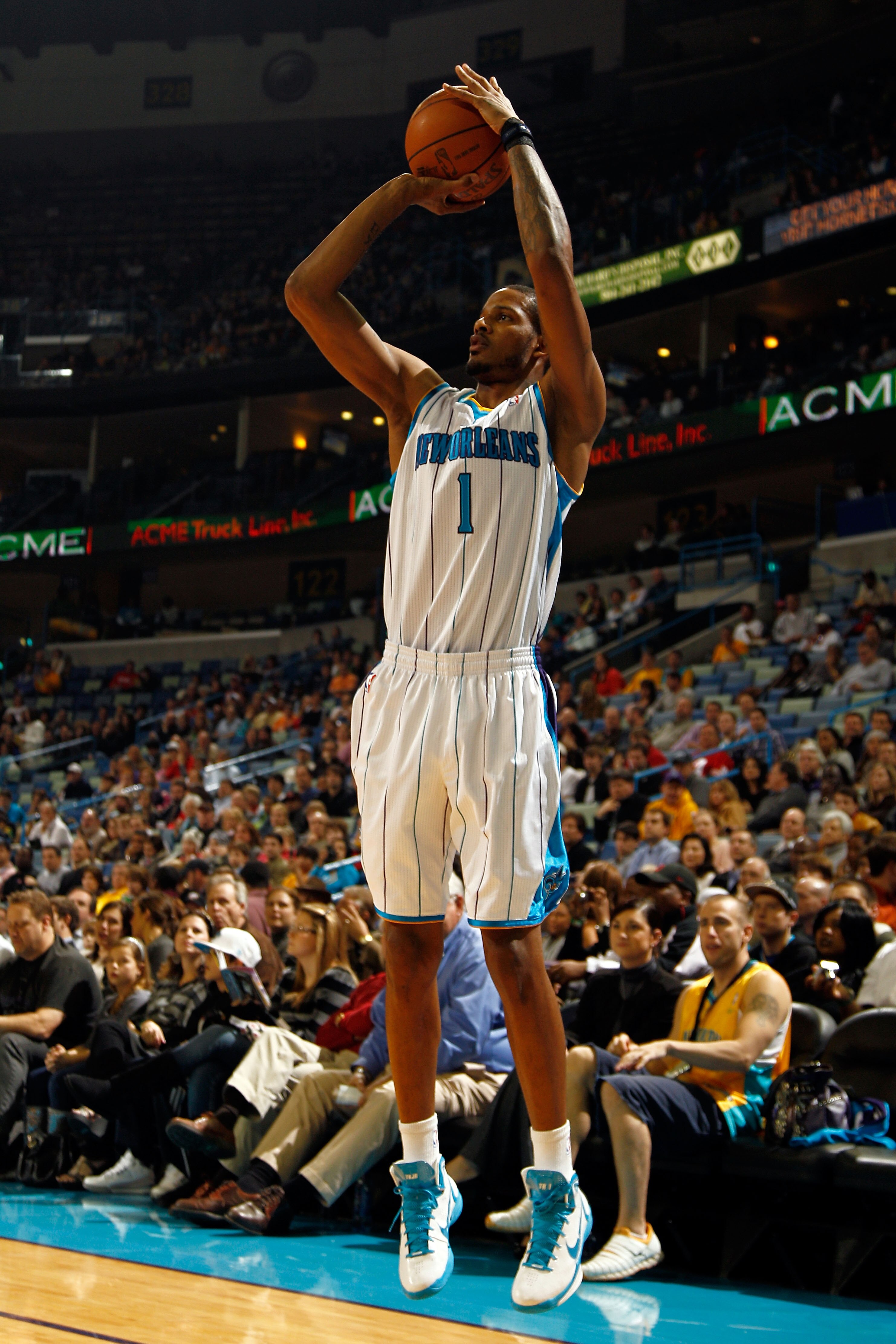 NEW ORLEANS, LA - JANUARY 03:  Trevor Ariza #1 of the New Orleans Hornets shoots a three-pointer against the Philadelphia 76ers at New Orleans Arena on January 3, 2011 in New Orleans, Louisiana. NOTE TO USER: User expressly acknowledges and agrees that, b