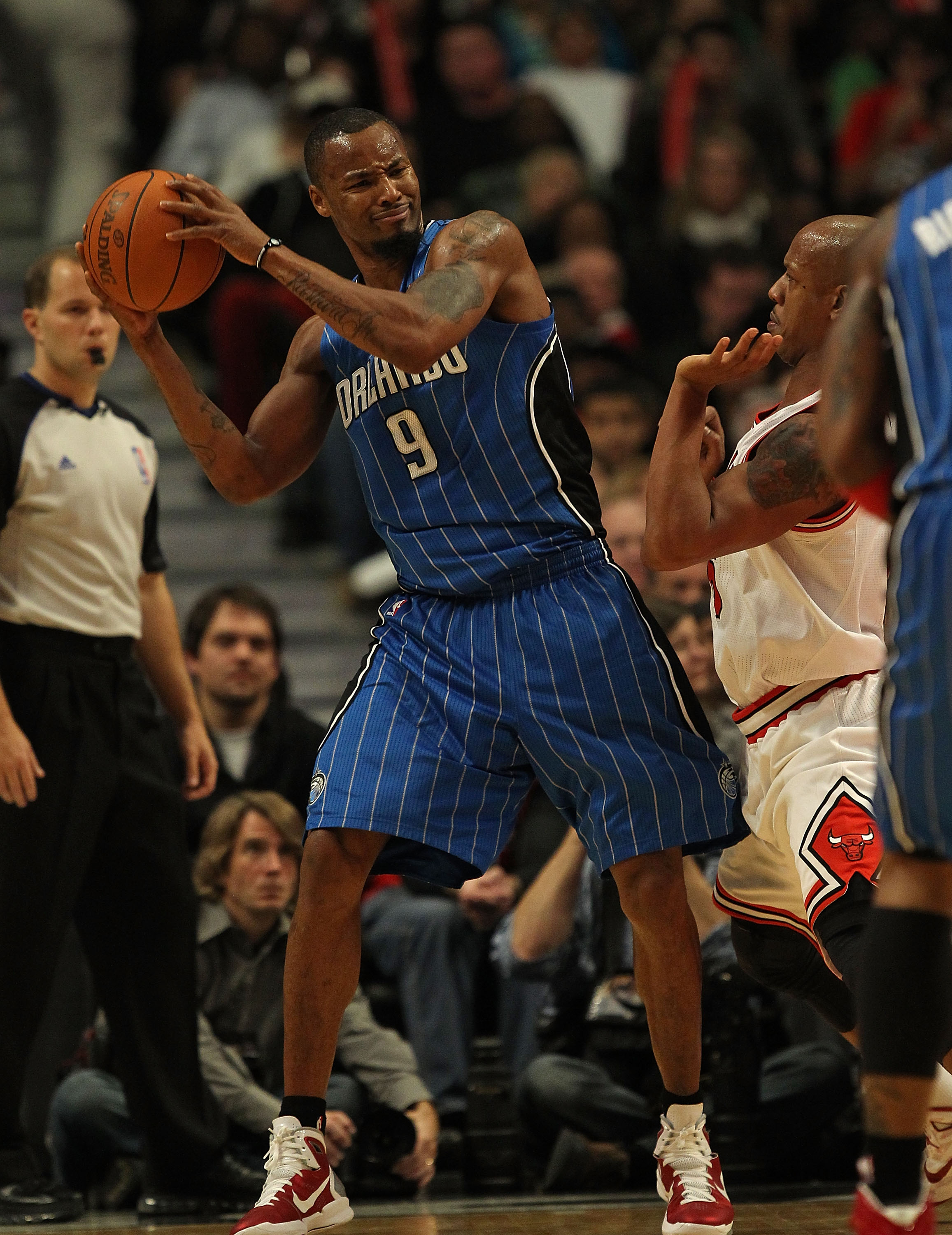CHICAGO, IL - DECEMBER 01: Rashard Lewis #9 of the Orlando Magic looks to pass under pressure from Keith Bogans #6 of the Chicago Bulls at the United Center on December 1, 2010 in Chicago, Illinois. The Magic defeated the Bulls 107-78. NOTE TO USER: User