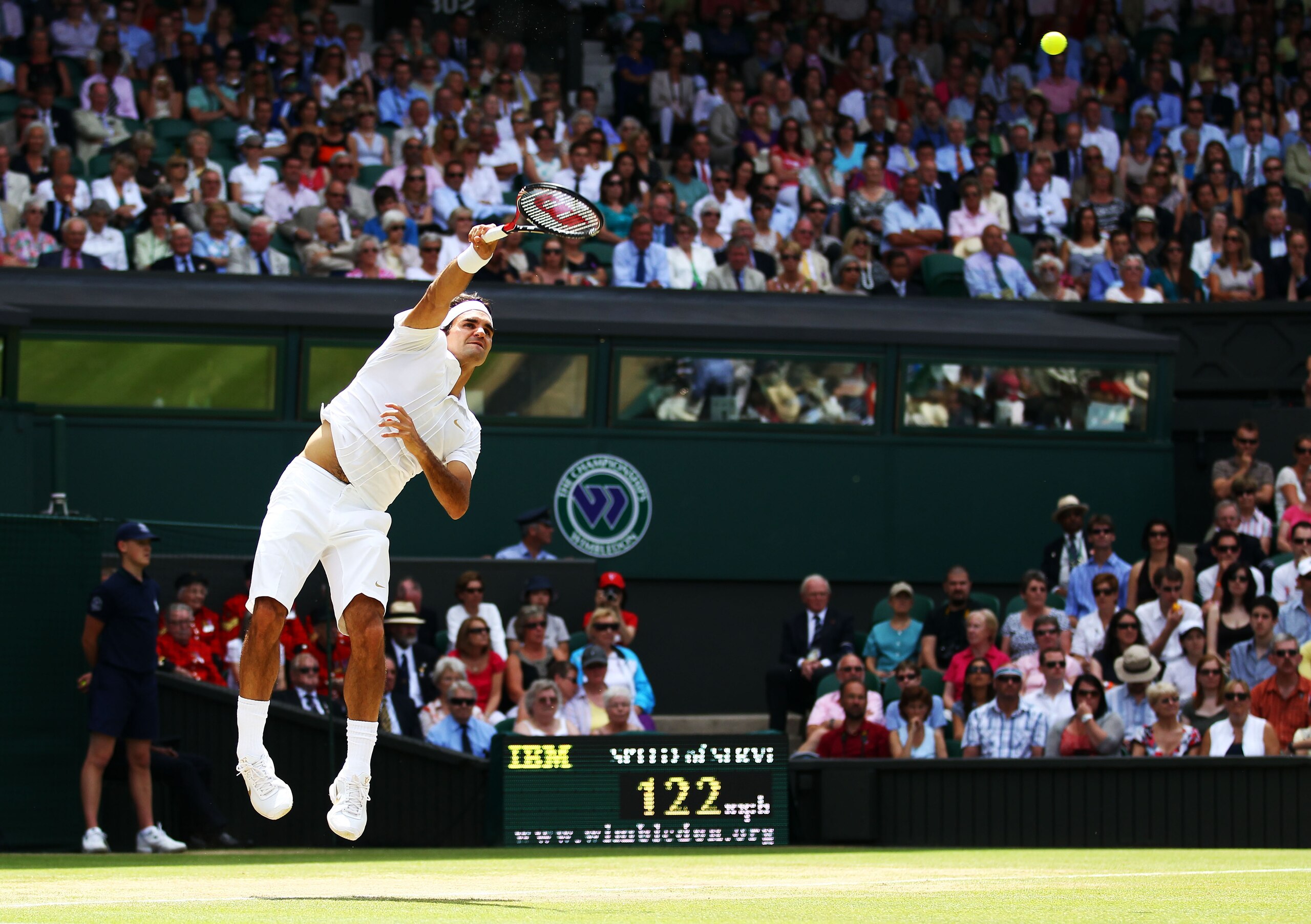 LONDON, ENGLAND - JUNE 30:  Roger Federer of Switzerland serves during his Quarter Final match against Tomas Berdych of Czech Republic on Day Nine of the Wimbledon Lawn Tennis Championships at the All England Lawn Tennis and Croquet Club on June 30, 2010