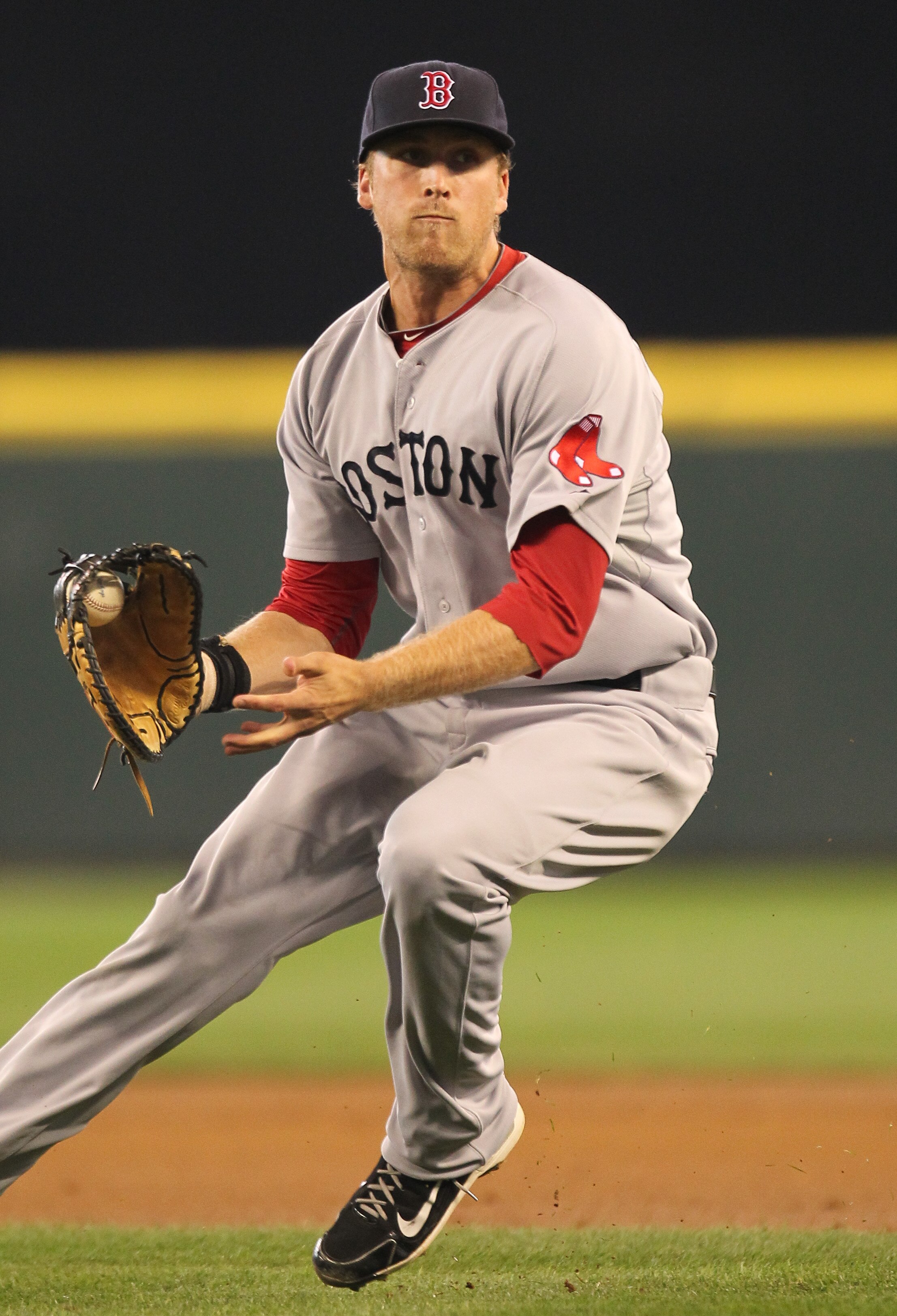 SEATTLE - SEPTEMBER 15:  First baseman Lars Anderson #44 of the Boston Red Sox fields a bunt during the game against the Seattle Mariners at Safeco Field on September 15, 2010 in Seattle, Washington. (Photo by Otto Greule Jr/Getty Images)