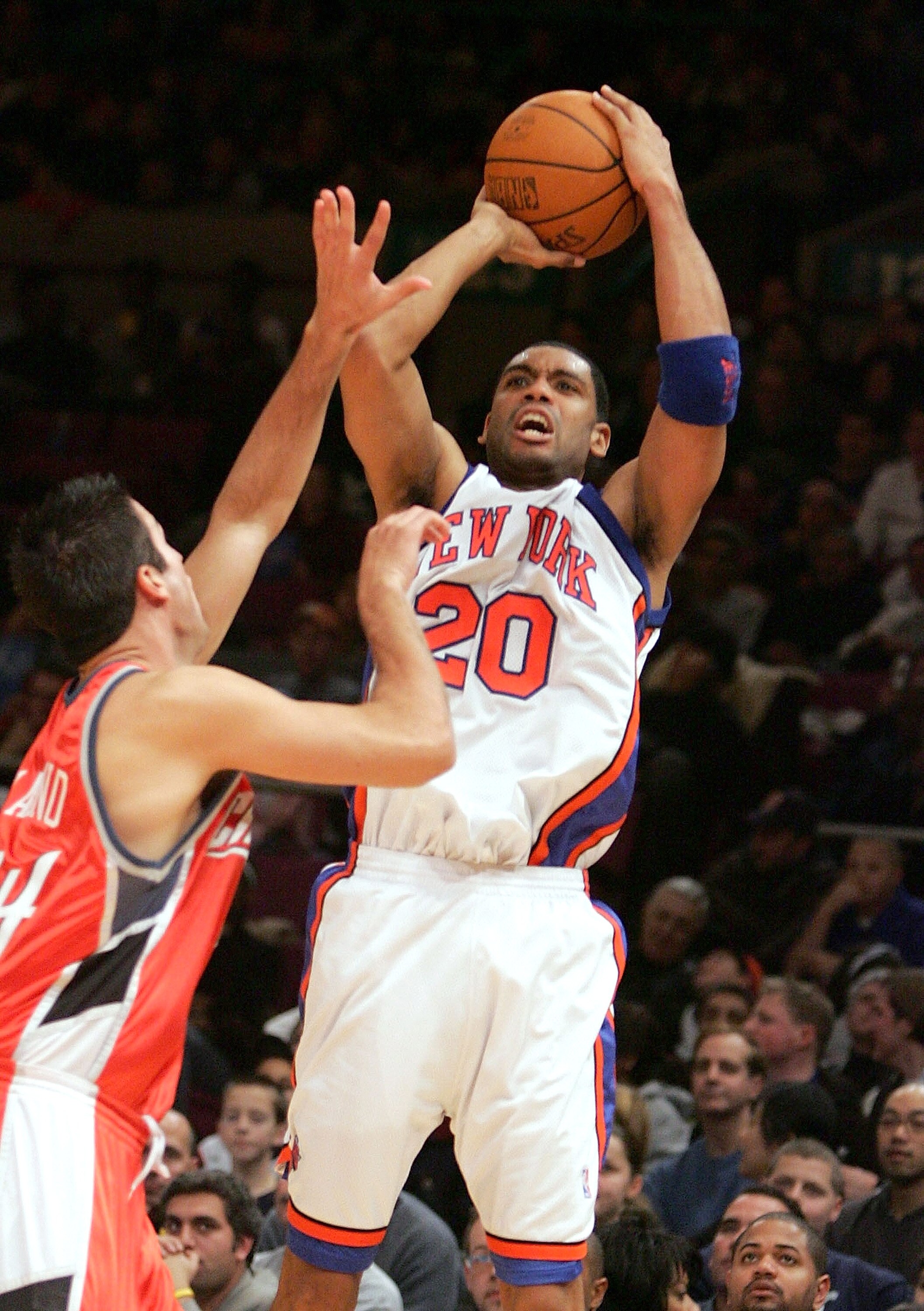 NEW YORK - DECEMBER 26:  Allan Houston #20 of the New York Knicks shoots over Jason Kapono #24 of the Charlotte Bobcats during the second half of their game on December 26, 2004 at Madison Square Garden in New York City.  NOTE TO USER:  User expressly ack