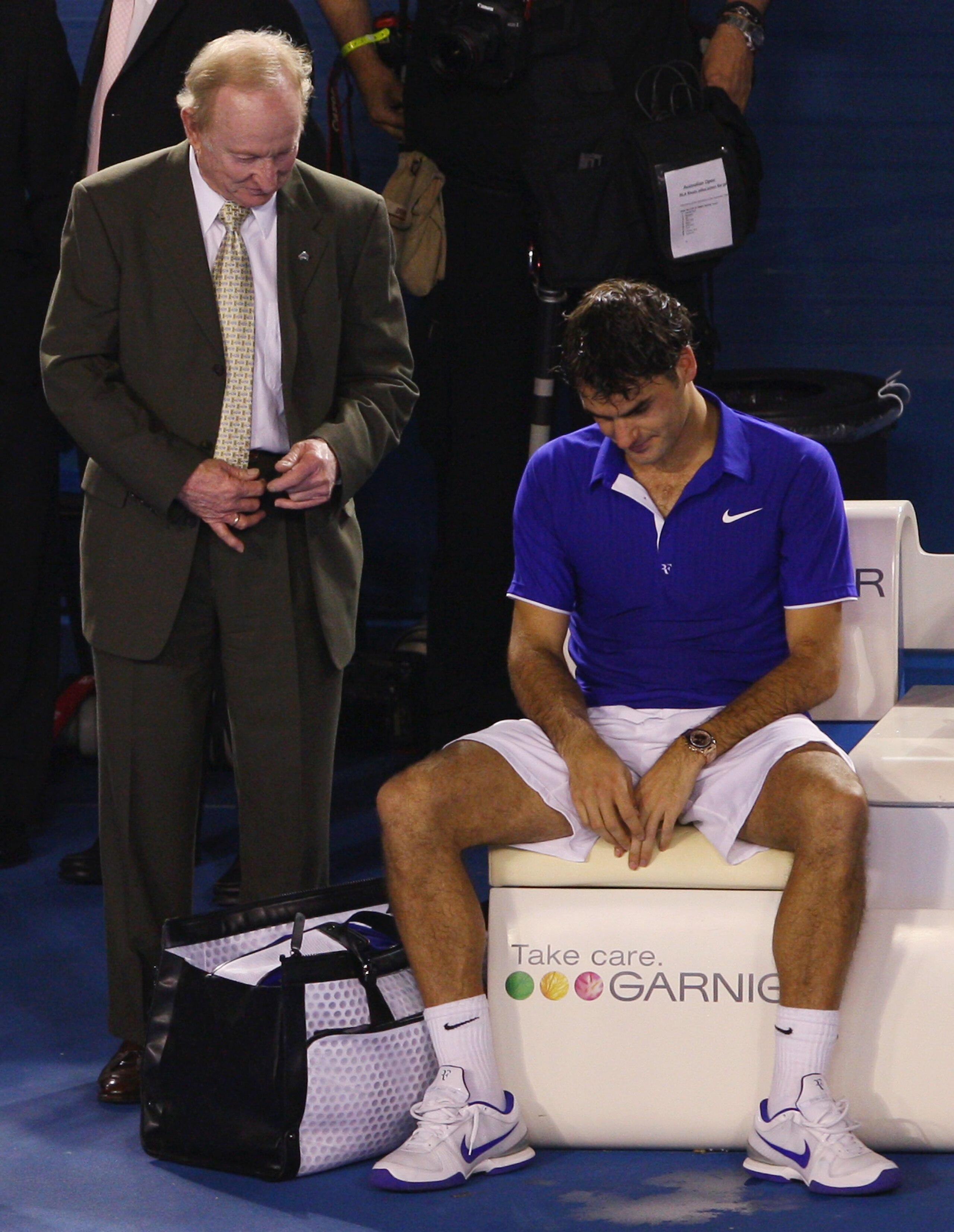 MELBOURNE, AUSTRALIA - FEBRUARY 01:  Australian tennis legend Rod Laver consoles Roger Federer of Switzerland after the men's final match against Rafael Nadal of Spain during day fourteen of the 2009 Australian Open at Melbourne Park on  February 1, 2009