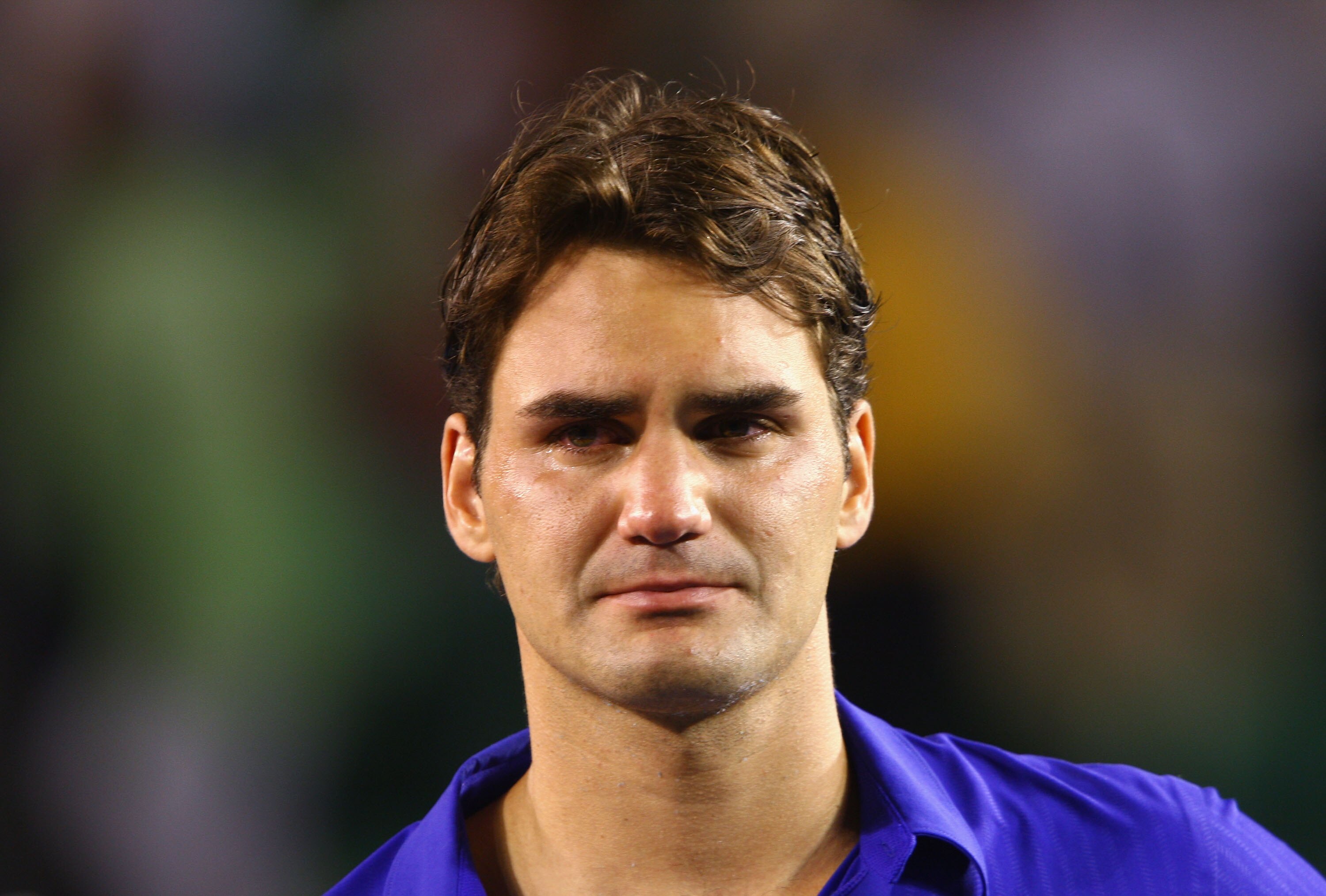 MELBOURNE, AUSTRALIA - FEBRUARY 01:  Roger Federer of Switzerland shows his emotion during the trophy presentation after his men's final match against Rafael Nadal of Spain during day fourteen of the 2009 Australian Open at Melbourne Park on  February 1,