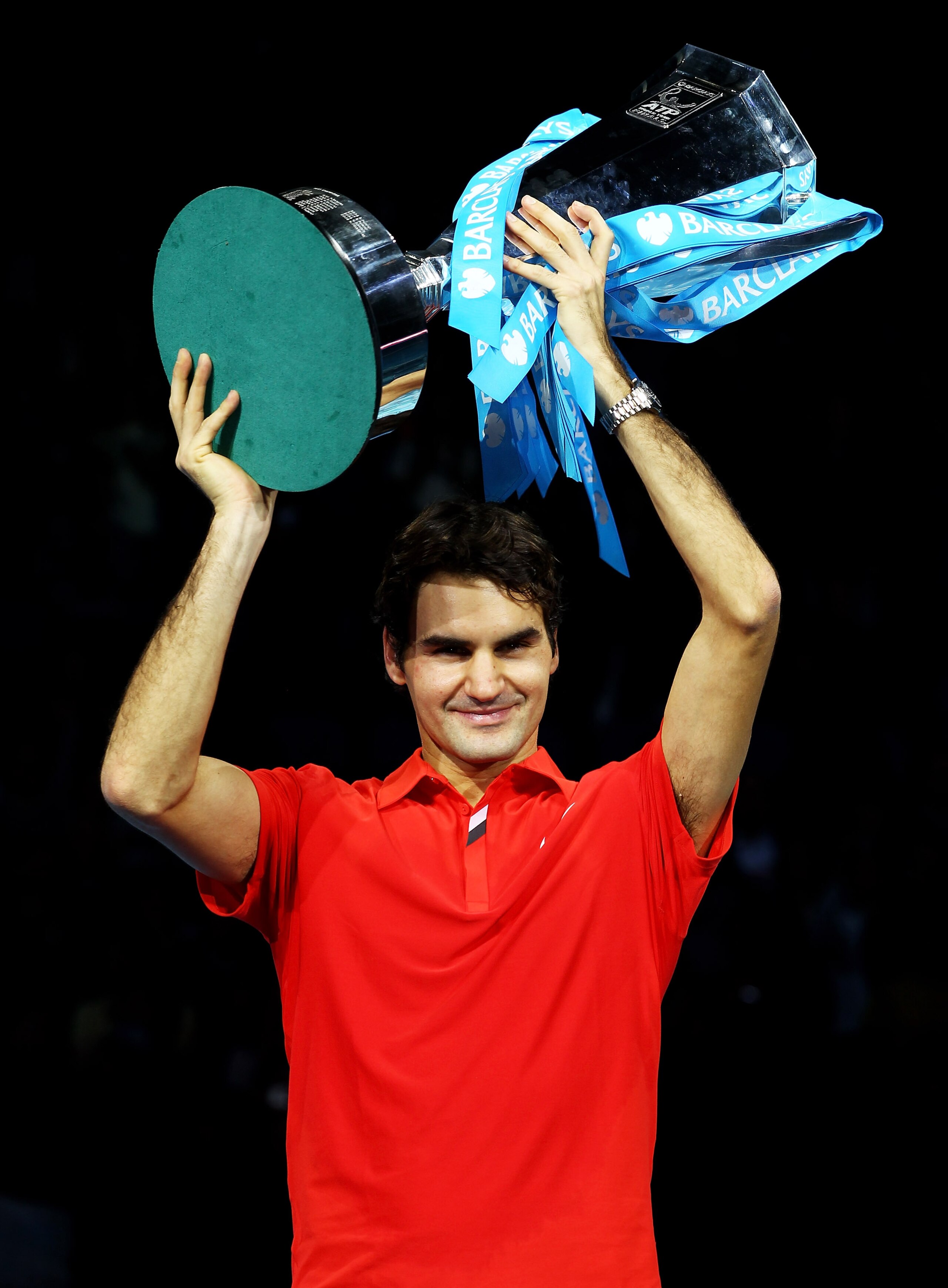 LONDON, ENGLAND - NOVEMBER 28:  Roger Federer of Switzerland poses with the trophy after defeating Rafael Nadal of Spain in their men's final match during the ATP World Tour Finals at O2 Arena on November 28, 2010 in London, England.  (Photo by Julian Fin