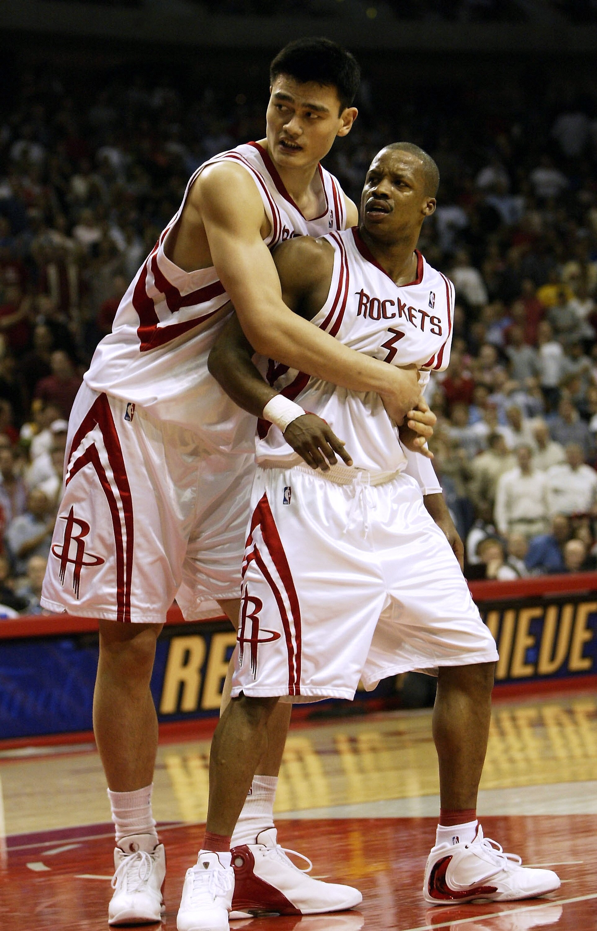 HOUSTON - APRIL 25:   Yao Ming #11 of the Houston Rockets holds Steve Francis #3 out of an altercation with the Los Angeles Lakers during Game four of the Western Conference Quarterfinals during the 2004 NBA Playoffs on April 25, 2004 at the Toypota Cente