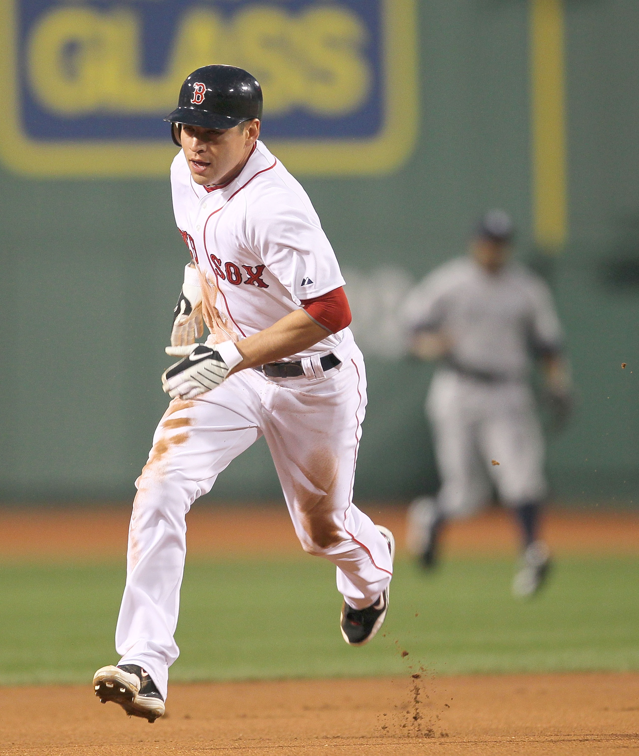 BOSTON - APRIL 06:  Jacoby Ellsbury #2 of the Boston Red Sox runs on an errant throw against the New York Yankees at Fenway Park on April 6, 2010 in Boston, Massachusetts. (Photo by Jim Rogash/Getty Images)