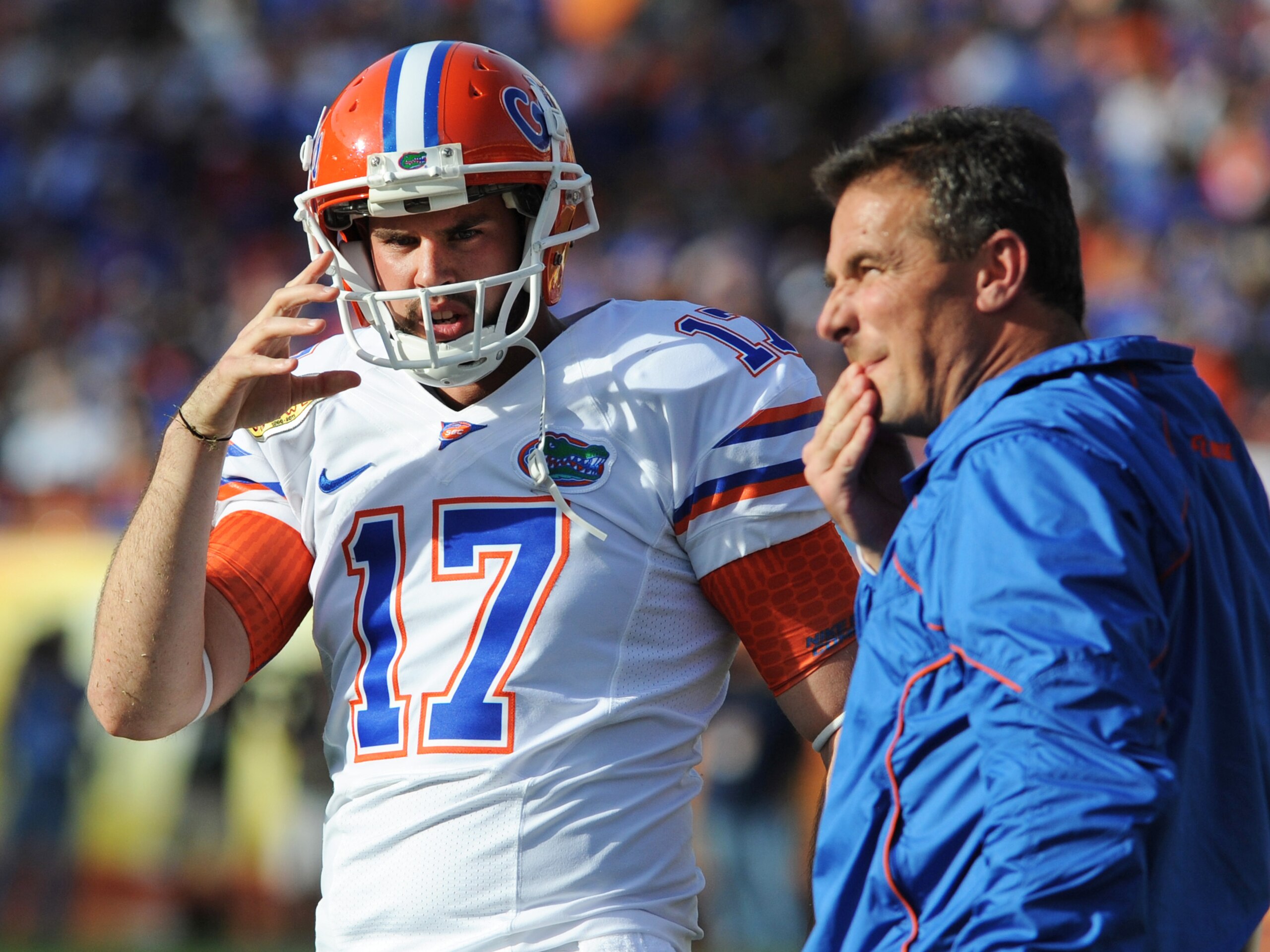 TAMPA, FL - JANUARY 1:  Kicker Chas Henry talks with coach Urban Meyer of the Florida Gators during play against the Penn State Nittany Lions January 1, 2010 in the 25th Outback Bowl at Raymond James Stadium in Tampa, Florida.  (Photo by Al Messerschmidt/