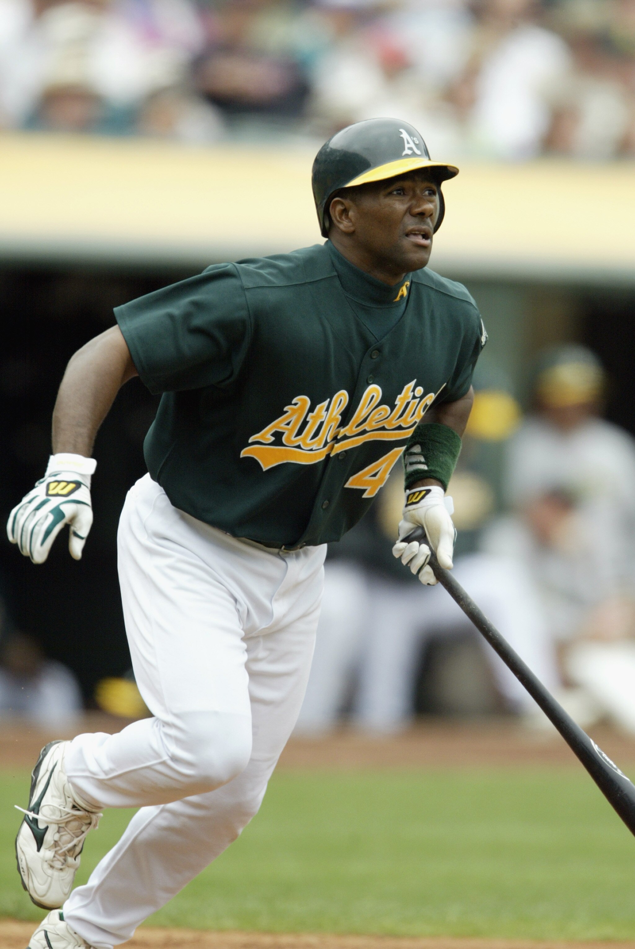 OAKLAND, CA - AUGUST 28:  Miguel Tejada #4 of the Oakland Athletics watches the ball as he runs to first against the Baltimore Orioles during a game at the Network Associates Coliseum on August 28, 2003 in Oakland, California.  The A's won 6-4.  (Photo by