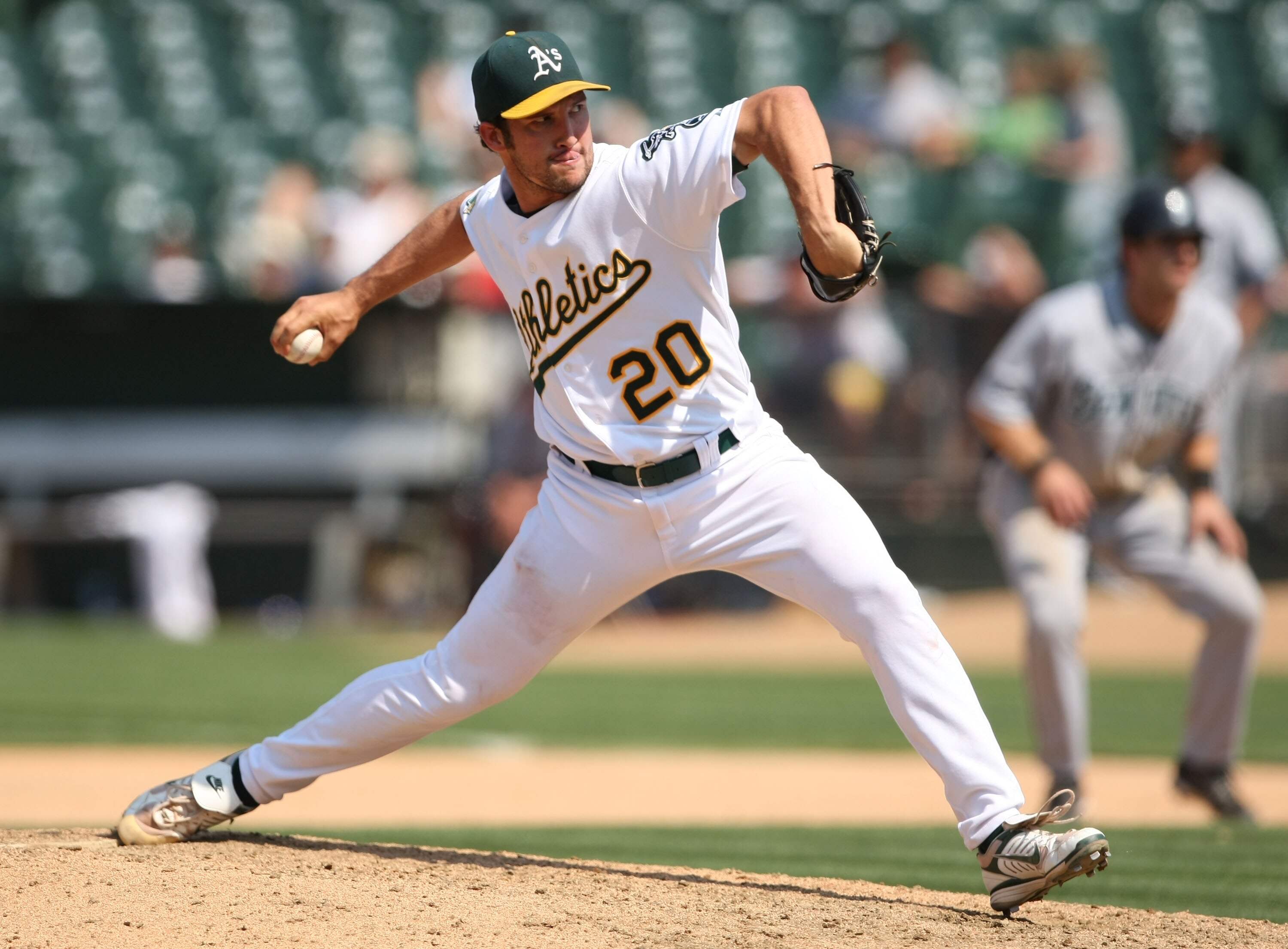 OAKLAND, CA - JULY 10:  Huston Street #20 of the Oakland Athletics pitches against the Seattle Mariners in the first inning during a Major League Baseball game on July 10, 2008 at McAfee Coliseum in Oakland, California.  (Photo by Jed Jacobsohn/Getty Imag