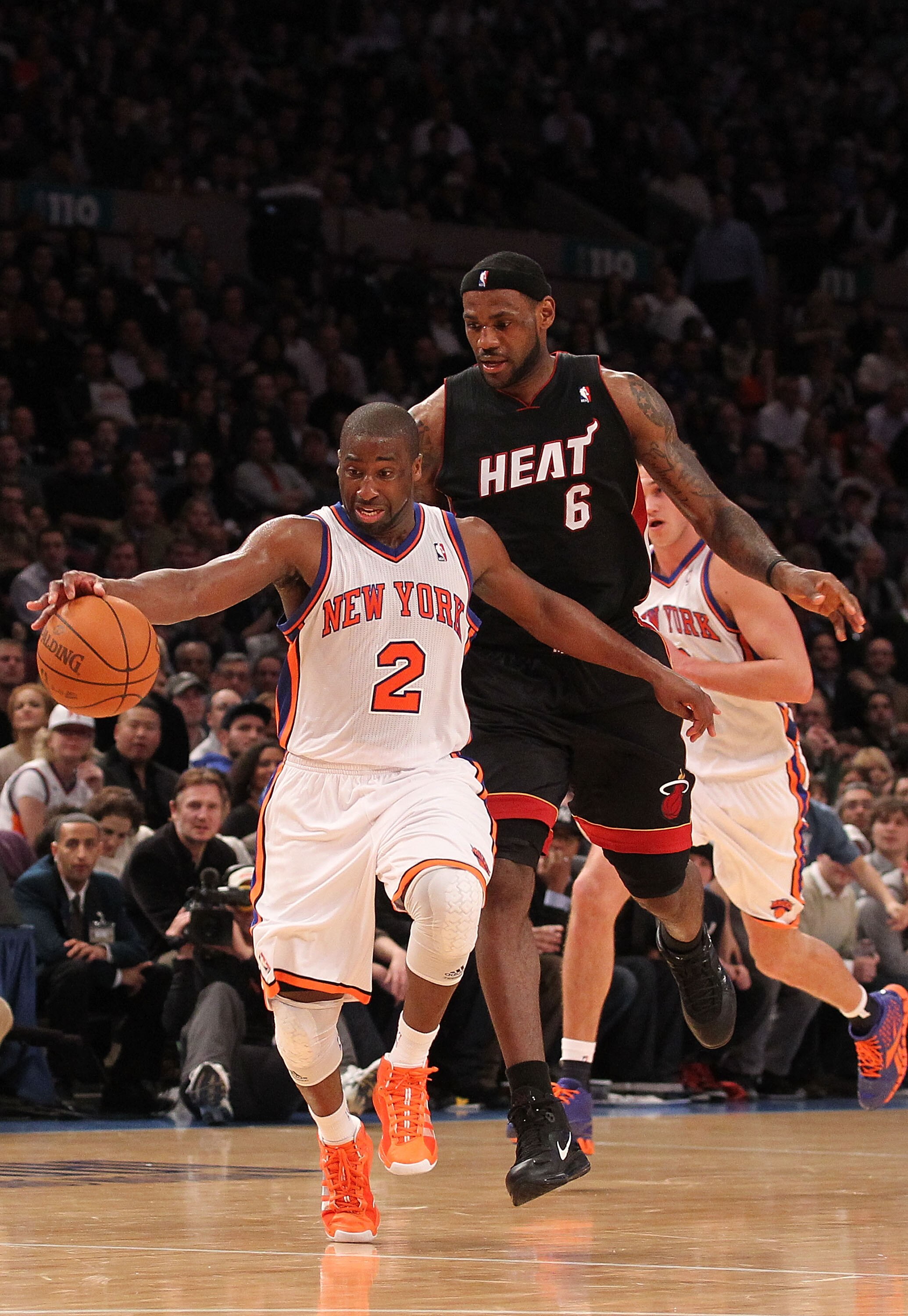 NEW YORK, NY - DECEMBER 17:  Raymond Felton #2 of the New York Knicks dribbles the ball as LeBron James #6 of the Miami Heat gives chase at Madison Square Garden on December 17, 2010 in New York City. NOTE TO USER: User expressly acknowledges and agrees t