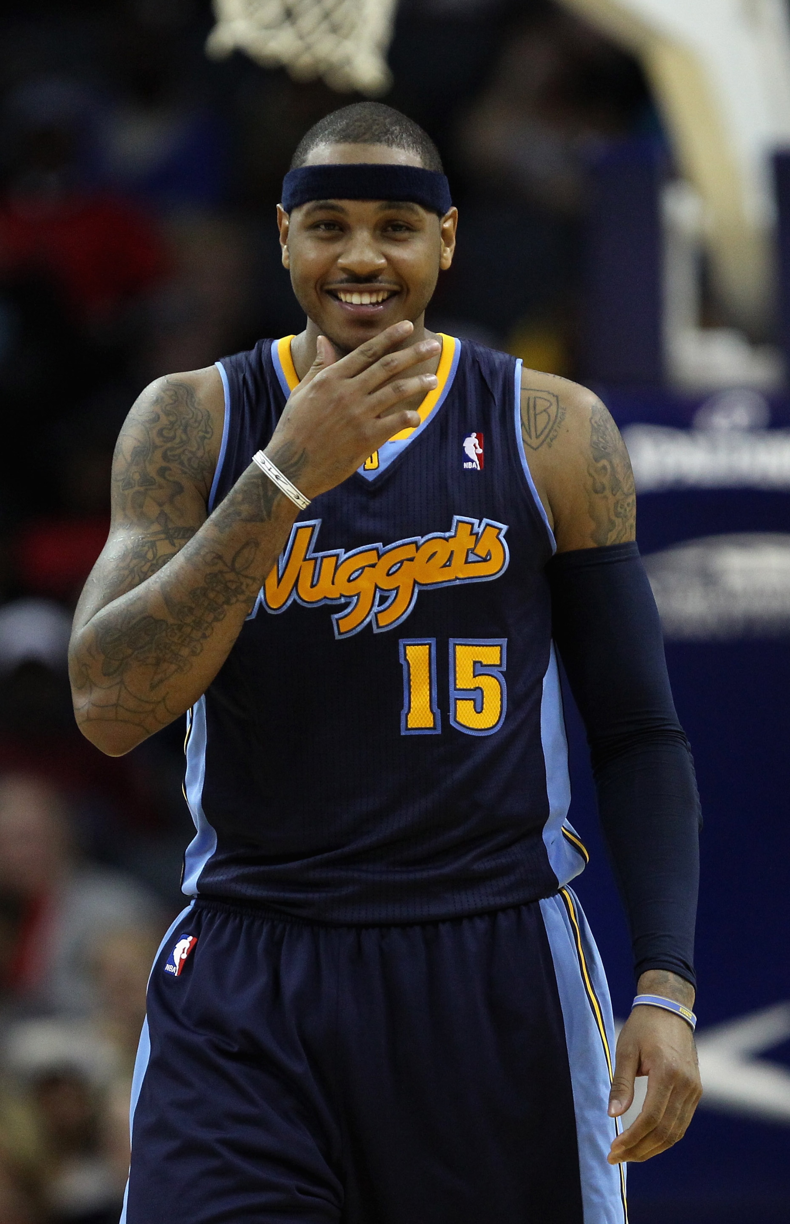 CHARLOTTE, NC - DECEMBER 07: Carmelo Anthony #15 of the Denver Nuggets watches on against the Charlotte Bobcats during their game at Time Warner Cable Arena on December 7, 2010 in Charlotte, North Carolina. NOTE TO USER: User expressly acknowledges and CHARLOTTE, NC - DECEMBER 07: Carmelo Anthony #15 of the Denver Nuggets watches on against the Charlotte Bobcats during their game at Time Warner Cable Arena on December 7, 2010 in Charlotte, North Carolina. NOTE TO USER: User expressly acknowledges and
