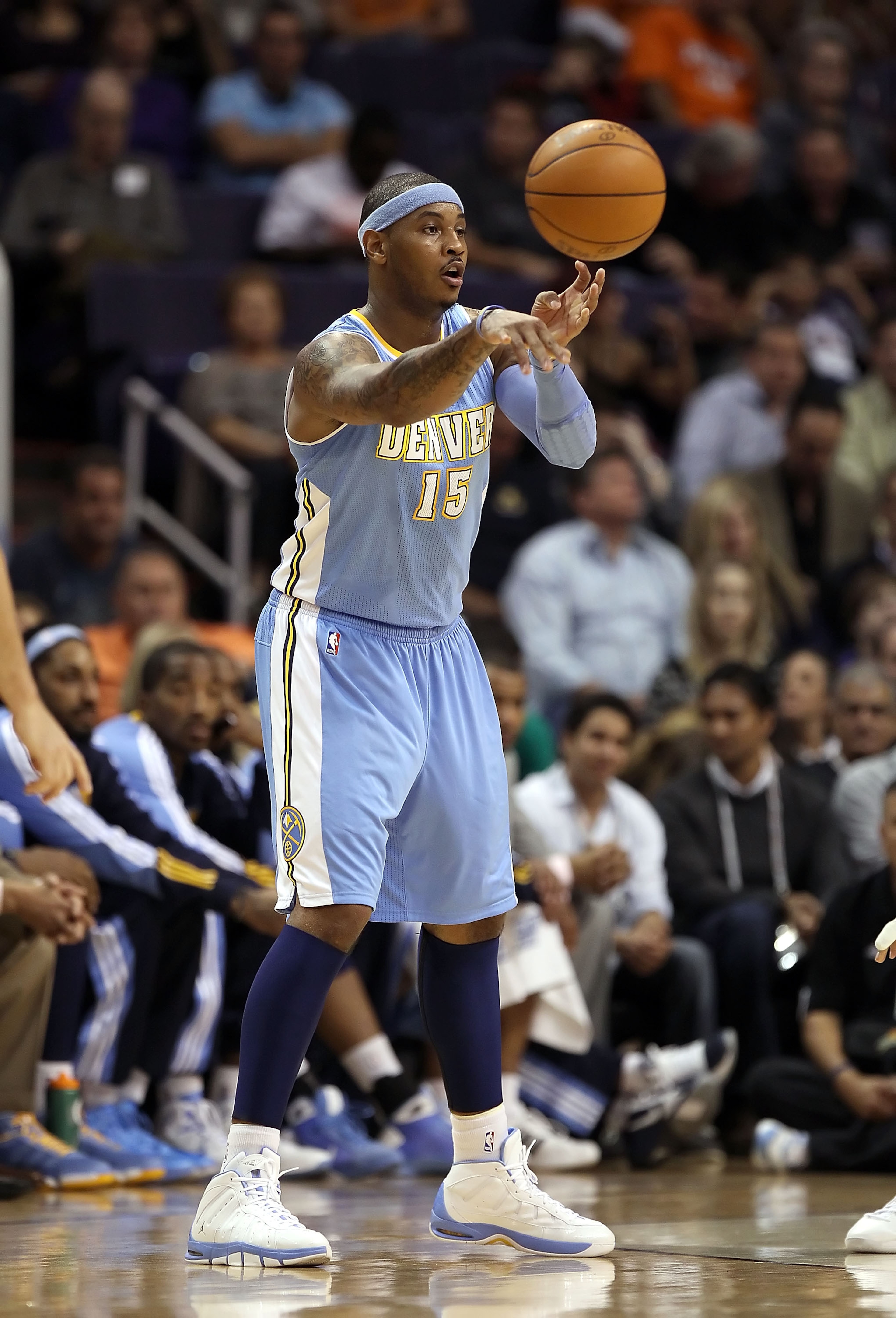 PHOENIX - NOVEMBER 15: Carmelo Anthony #15 of the Denver Nuggets passes the ball during the NBA game against the Phoenix Suns at US Airways Center on November 15, 2010 in Phoenix, Arizona. The Suns defeated the Nuggets 100-94. NOTE TO USER: User expres PHOENIX - NOVEMBER 15: Carmelo Anthony #15 of the Denver Nuggets passes the ball during the NBA game against the Phoenix Suns at US Airways Center on November 15, 2010 in Phoenix, Arizona. The Suns defeated the Nuggets 100-94. NOTE TO USER: User expres