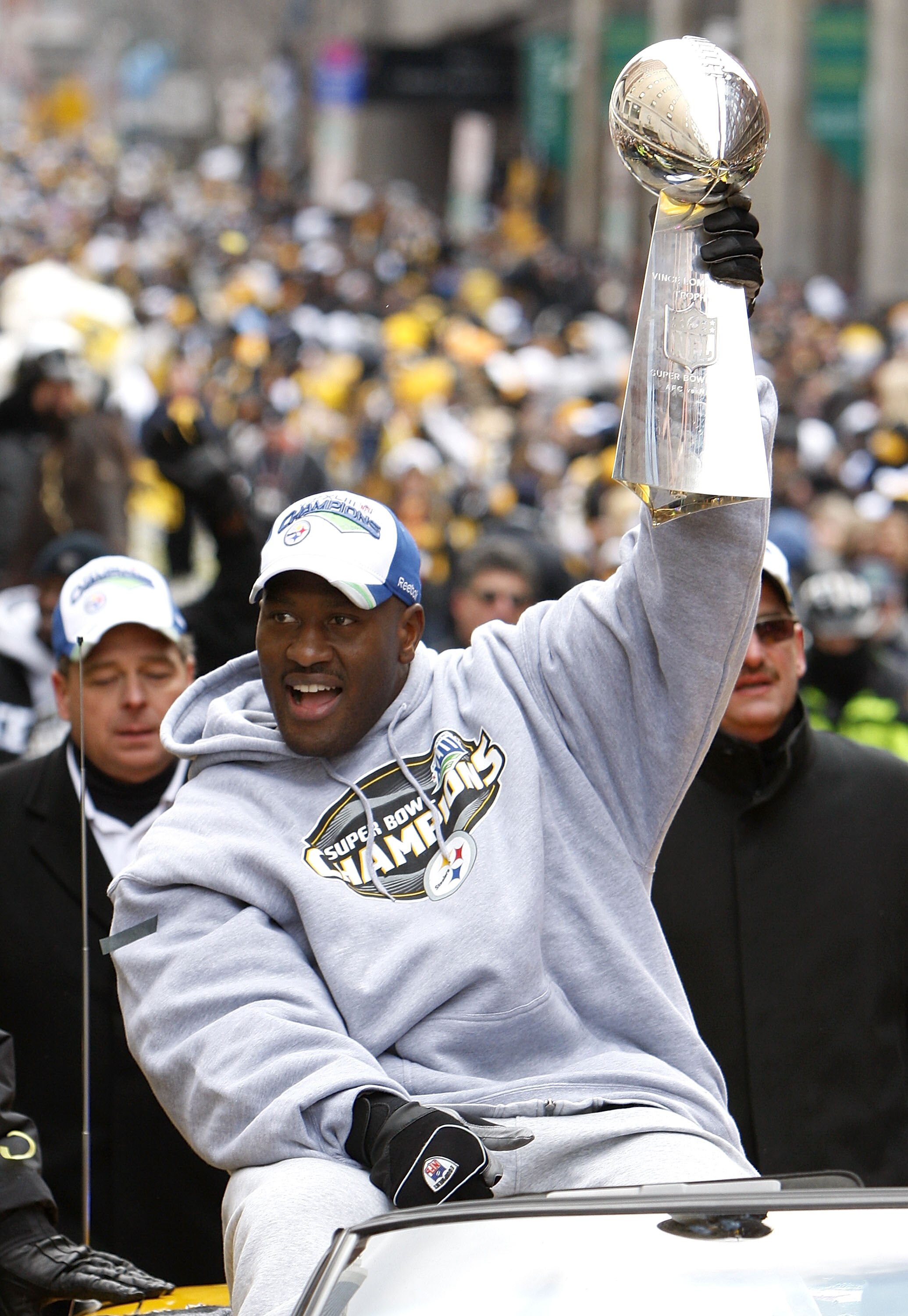 PITTSBURGH - FEBRUARY 03:  James Harrison #92 of the Pittsburgh Steelers shows off the Super Bowl XLIII trophy during a parade on February 3, 2009 in Pittsburgh, Pennsylvania.  (Photo by Gregory Shamus/Getty Images)
