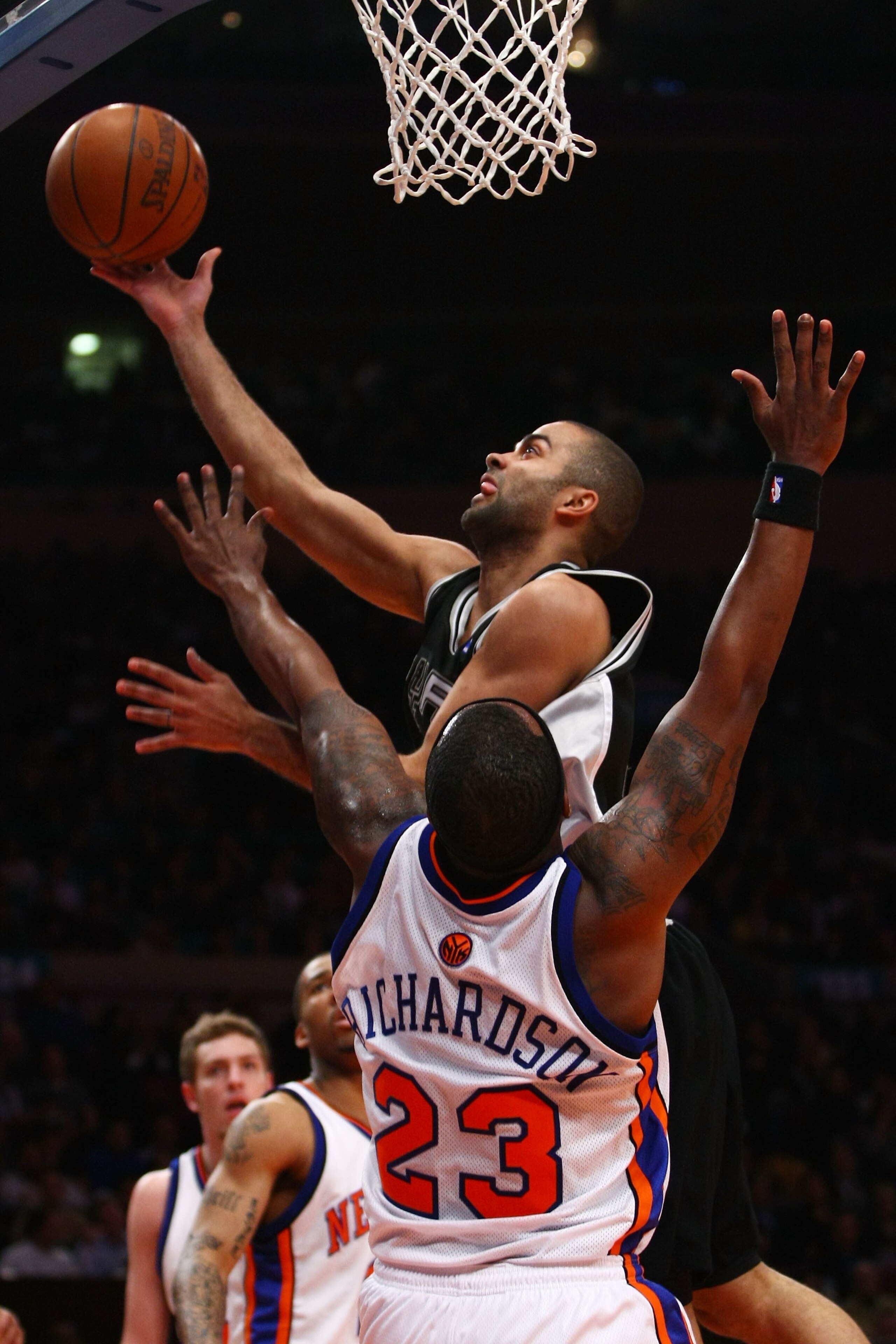 NEW YORK - FEBRUARY 17:  Tony Parker #9 of the San Antonio Spurs drives past Quentin Richardson #23 of the New York Knicks at Madison Square Garden February 17, 2009 in New York City. NOTE TO USER: User expressly acknowledges and agrees that, by downloadi