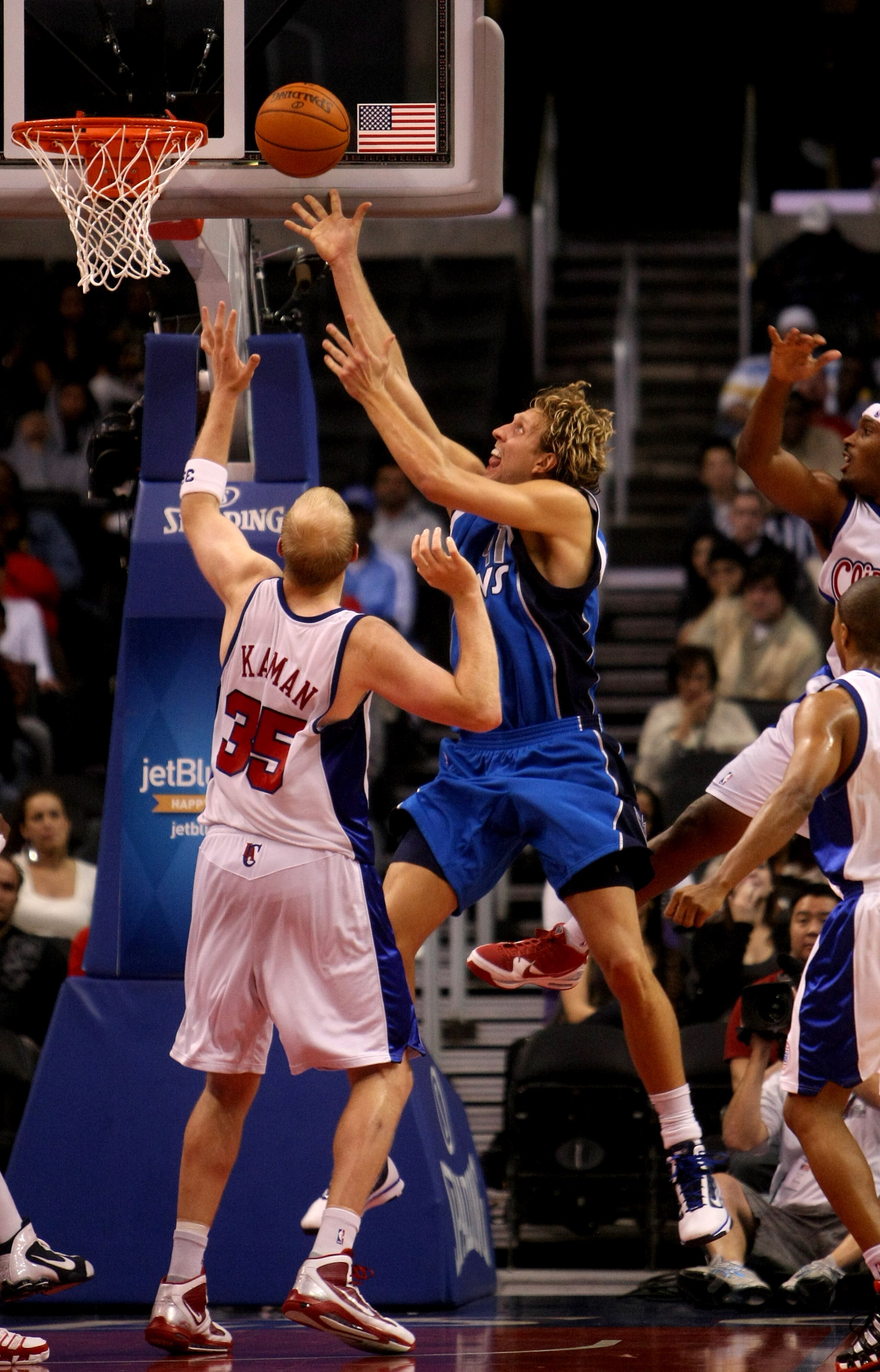 LOS ANGELES - OCTOBER 31: Dirk Nowitzki #41 of the Dallas Mavericks shoots over Chris Kaman #35 of the Los Angeles Clippers on October 31, 2009 at Staples Center in Los Angeles, California. Dallas won 93-84.   NOTE TO USER: User expressly acknowledges and