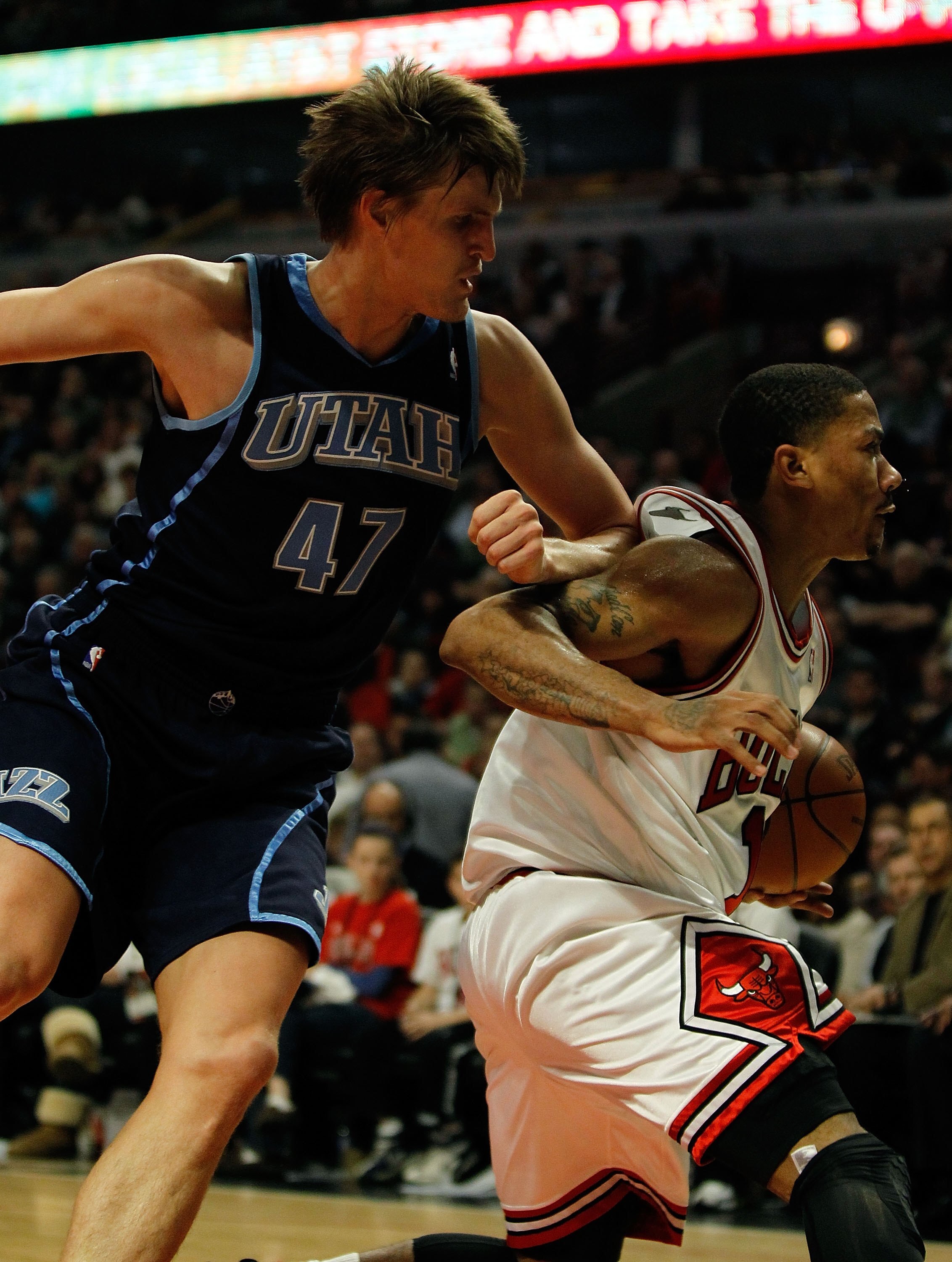 CHICAGO - MARCH 09: Andrei Kirilenko #47 of the Utah Jazz knocks Derrick Rose #1 of the Chicago Bulls in the back with his elbow at the United Center on March 9, 2010 in Chicago, Illinois. The Jazz defeated the Bulls 132-108. NOTE TO USER: User expressly