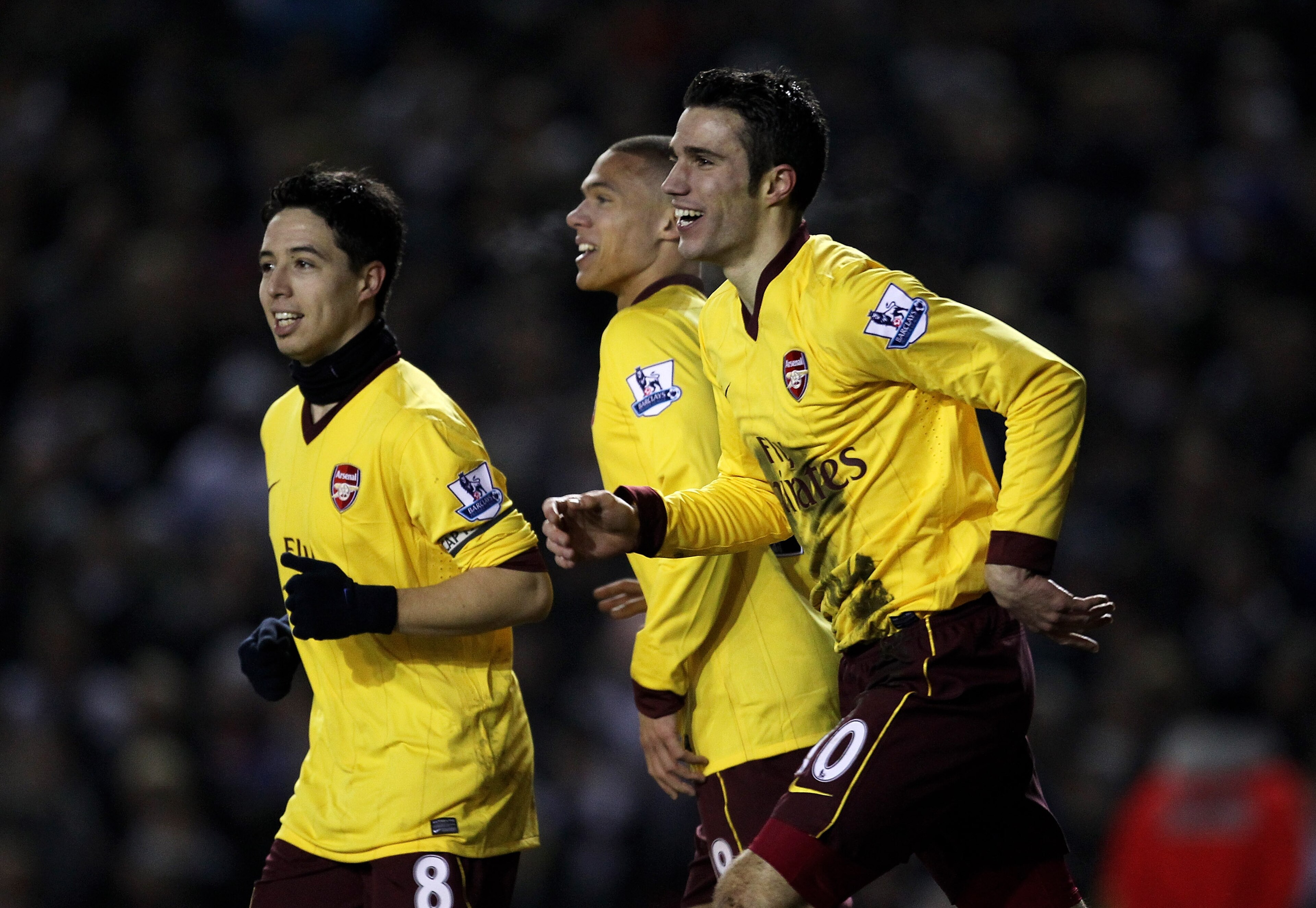 LEEDS, ENGLAND - JANUARY 19:  Robin van Persie of Arsenal celebrates scoring his team's third goal with team mates Samir Nasri (L) and Keiran Gibbs during the FA Cup sponsored by E.On Third Round Replay match between Leeds United and Arsenal at Elland Roa