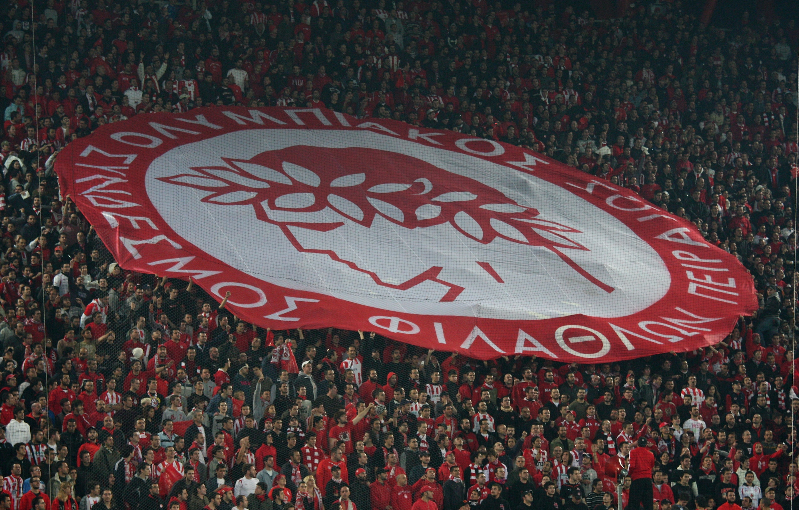 ATHENS, GREECE - DECEMBER 09:  Olympiakos fans during the UEFA Champions League Group H match between Olympiakos and Arsenal at the Georgios Karaiskakis Stadium on December 9, 2009 in Athens, Greece.  (Photo by Richard Heathcote/Getty Images)