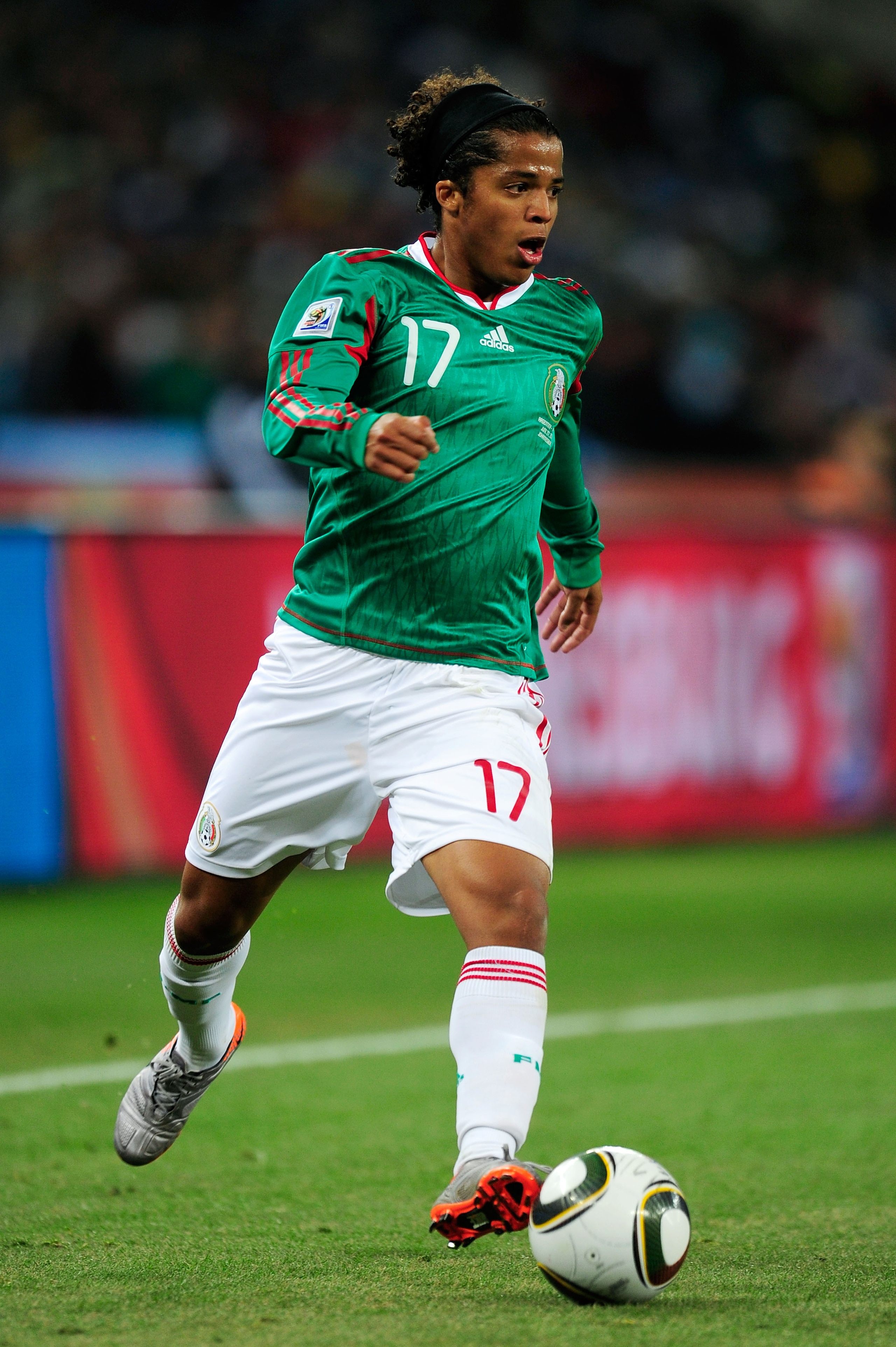 JOHANNESBURG, SOUTH AFRICA - JUNE 27:  Giovani Dos Santos of Mexico runs with the ball during the 2010 FIFA World Cup South Africa Round of Sixteen match between Argentina and Mexico at Soccer City Stadium on June 27, 2010 in Johannesburg, South Africa.  