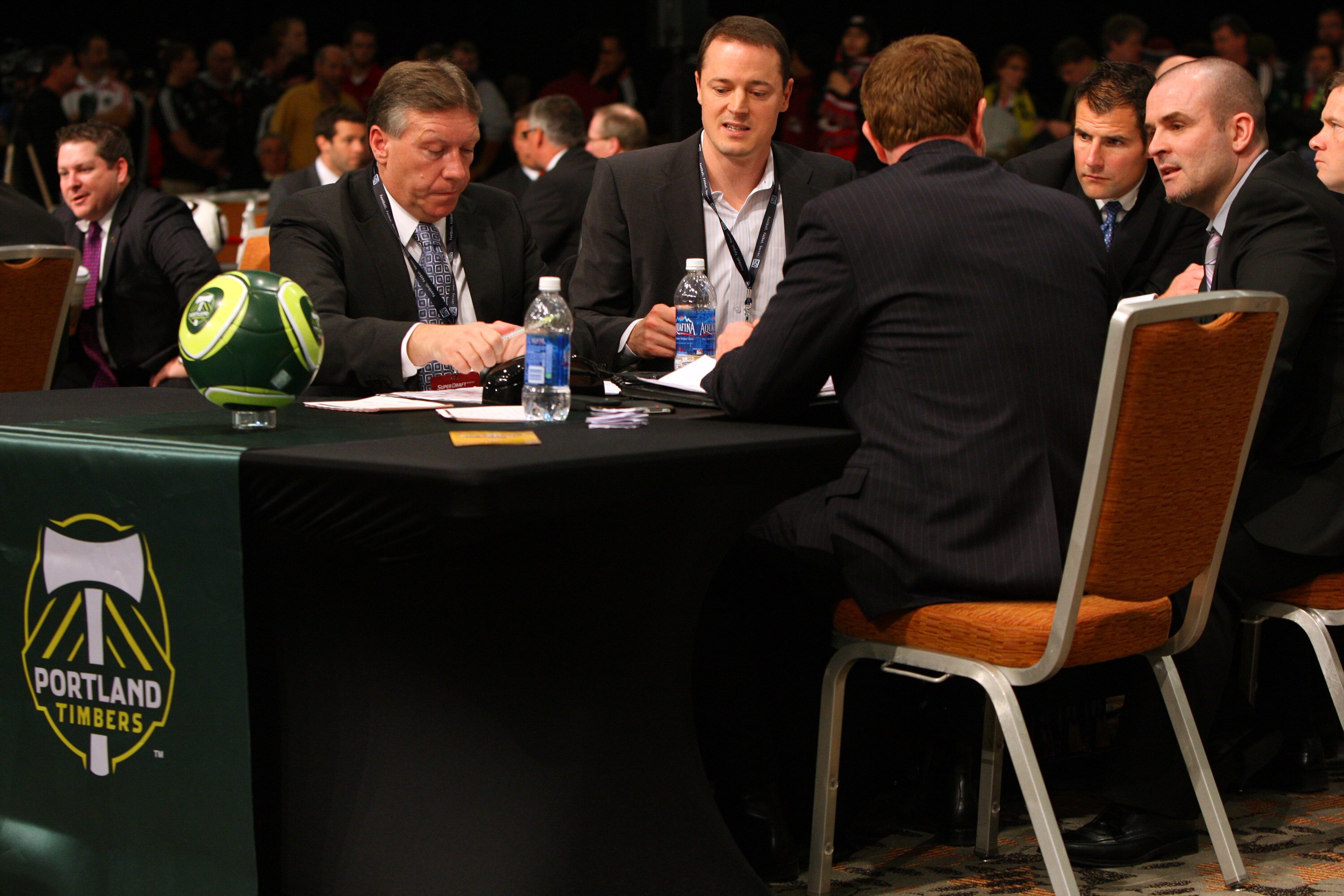 BALTIMORE - JANUARY 13: Coaches and front office staff of the Portland Timbers discuss options during the 2011 MLS SuperDraft on January 13, 2011 at the Baltimore Convention Center in Baltimore, Maryland. (Photo by Ned Dishman/Getty Images)