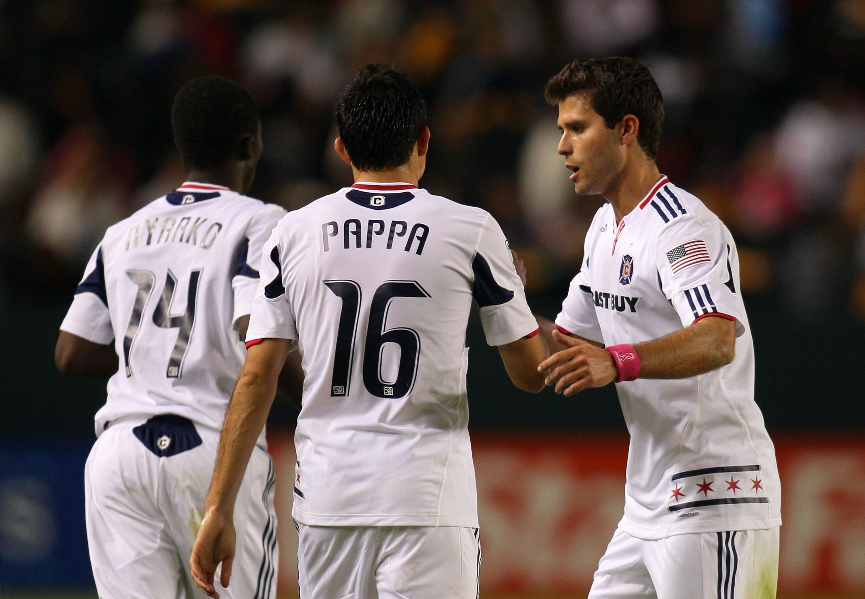 CARSON, CA - OCTOBER 23:  Peter Lowry #6 of the Chicago Fire congratulates teammate Marco Pappa #16 after a goal during the MLS match against Chivas USA on October 23, 2010 in Carson, California. The Fire defeated Chivas USA 4-1.  (Photo by Victor Decolon