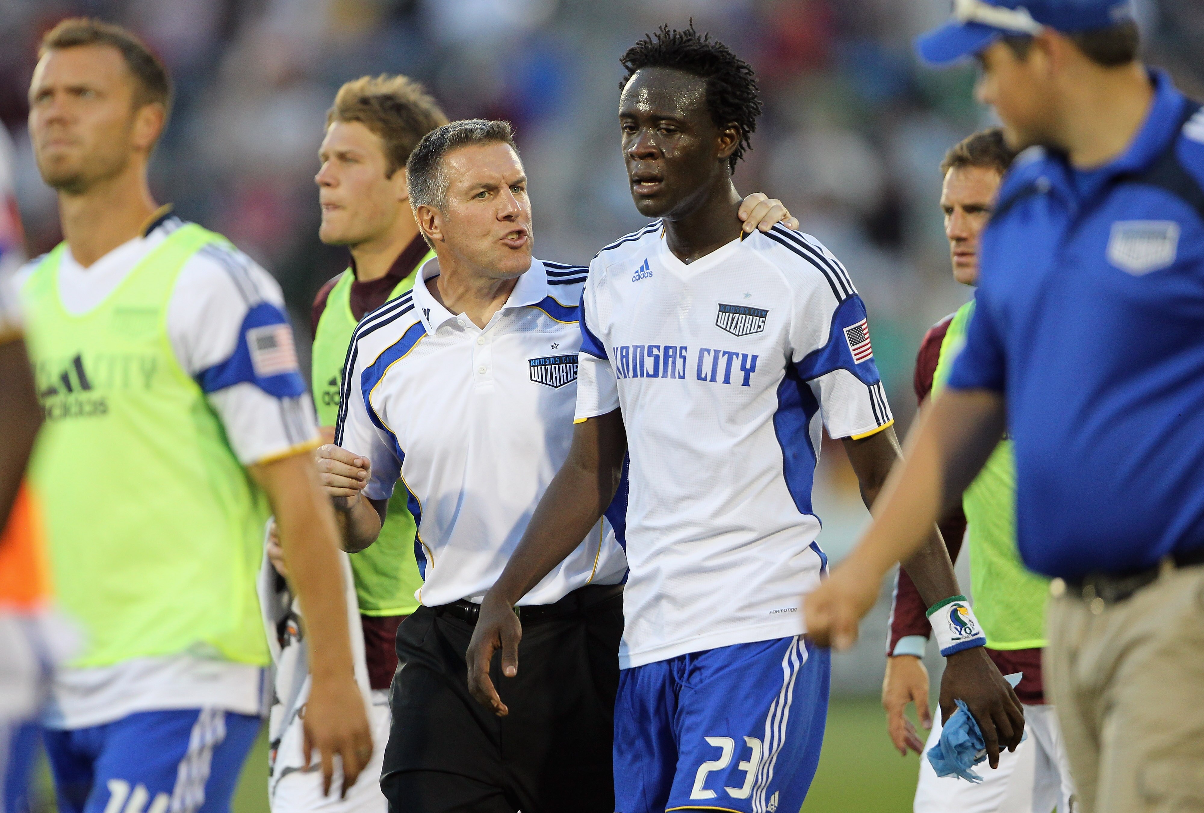 COMMERCE CITY, CO - JULY 17:  Kei Kamara #23 of the Kansas City Wizards and coach Peter Vermes head to the locker room at half time against the Colorado Rapids at Dick's Sporting Goods Park on July 17, 2010 in Commerce City, Colorado. The Wizards and the