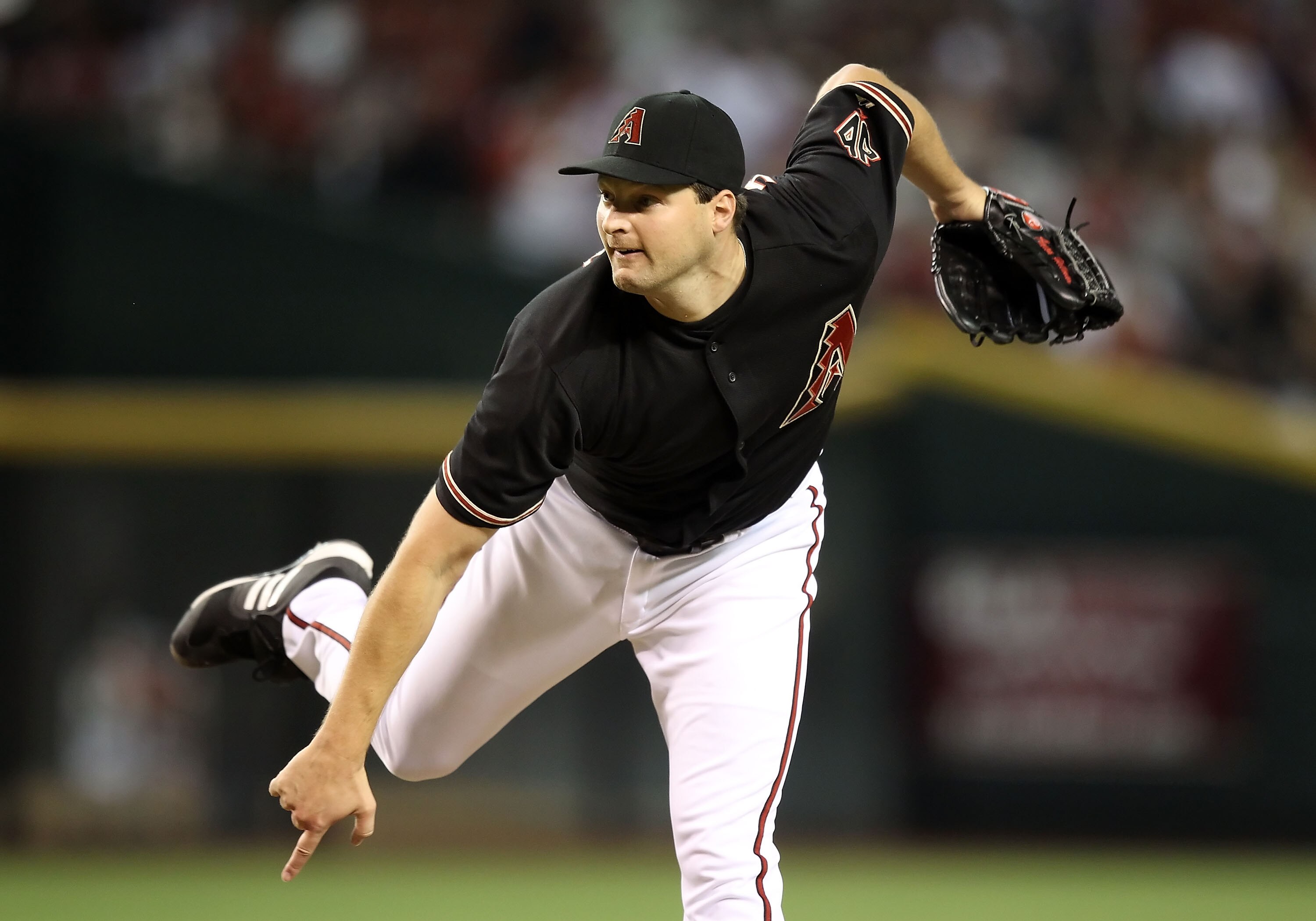 PHOENIX - AUGUST 07:  Relief pitcher Aaron Heilman #22 of the Arizona Diamondbacks pitches against the San Diego Padres during the Major League Baseball game at Chase Field on August 7, 2010 in Phoenix, Arizona.  (Photo by Christian Petersen/Getty Images)