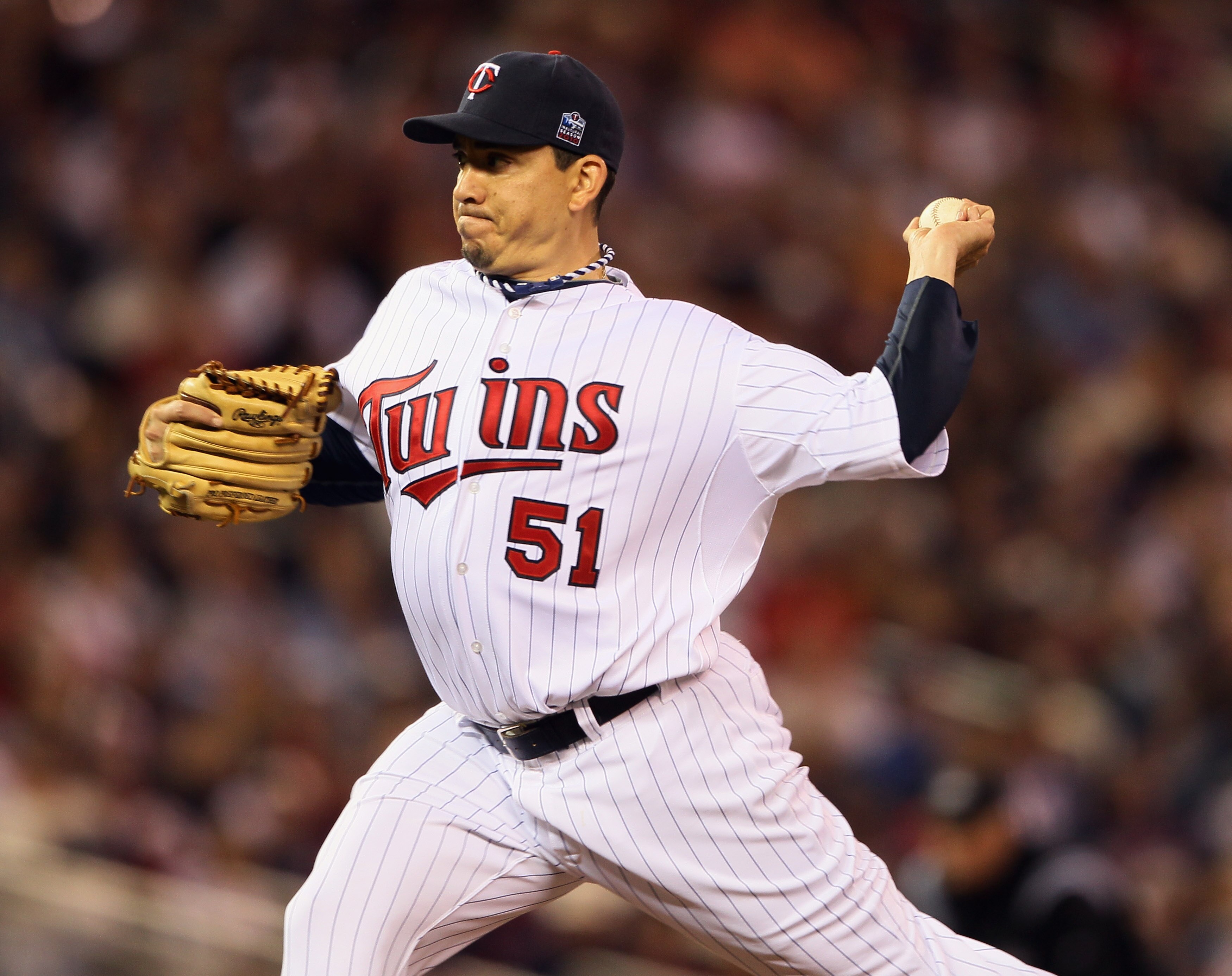 MINNEAPOLIS - OCTOBER 06:  Brian Fuentes #51 of the Minnesota Twins delivers a pitch against the New York Yankees during game one of the ALDS on October 6, 2010 at Target Field in Minneapolis, Minnesota. The Yankees defeated the Twins 6-4.  (Photo by Elsa