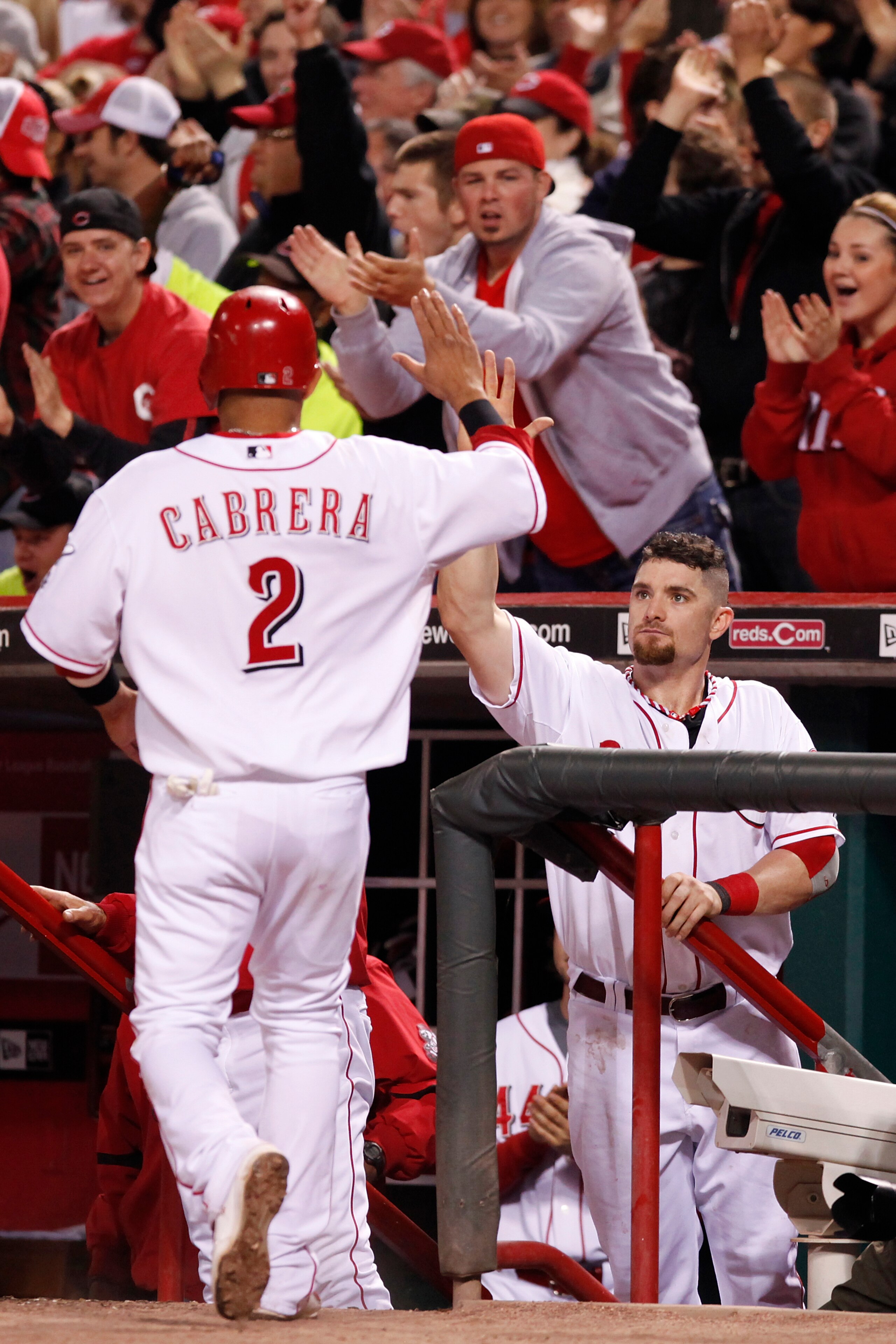CINCINNATI, OH - SEPTEMBER 28: Jonny Gomes #31 of the Cincinnati Reds greets Orlando Cabrera #2 after he scored the tying run against the Houston Astros at Great American Ball Park on September 28, 2010 in Cincinnati, Ohio. The Reds won 3-2 to clinch the CINCINNATI, OH - SEPTEMBER 28: Jonny Gomes #31 of the Cincinnati Reds greets Orlando Cabrera #2 after he scored the tying run against the Houston Astros at Great American Ball Park on September 28, 2010 in Cincinnati, Ohio. The Reds won 3-2 to clinch the