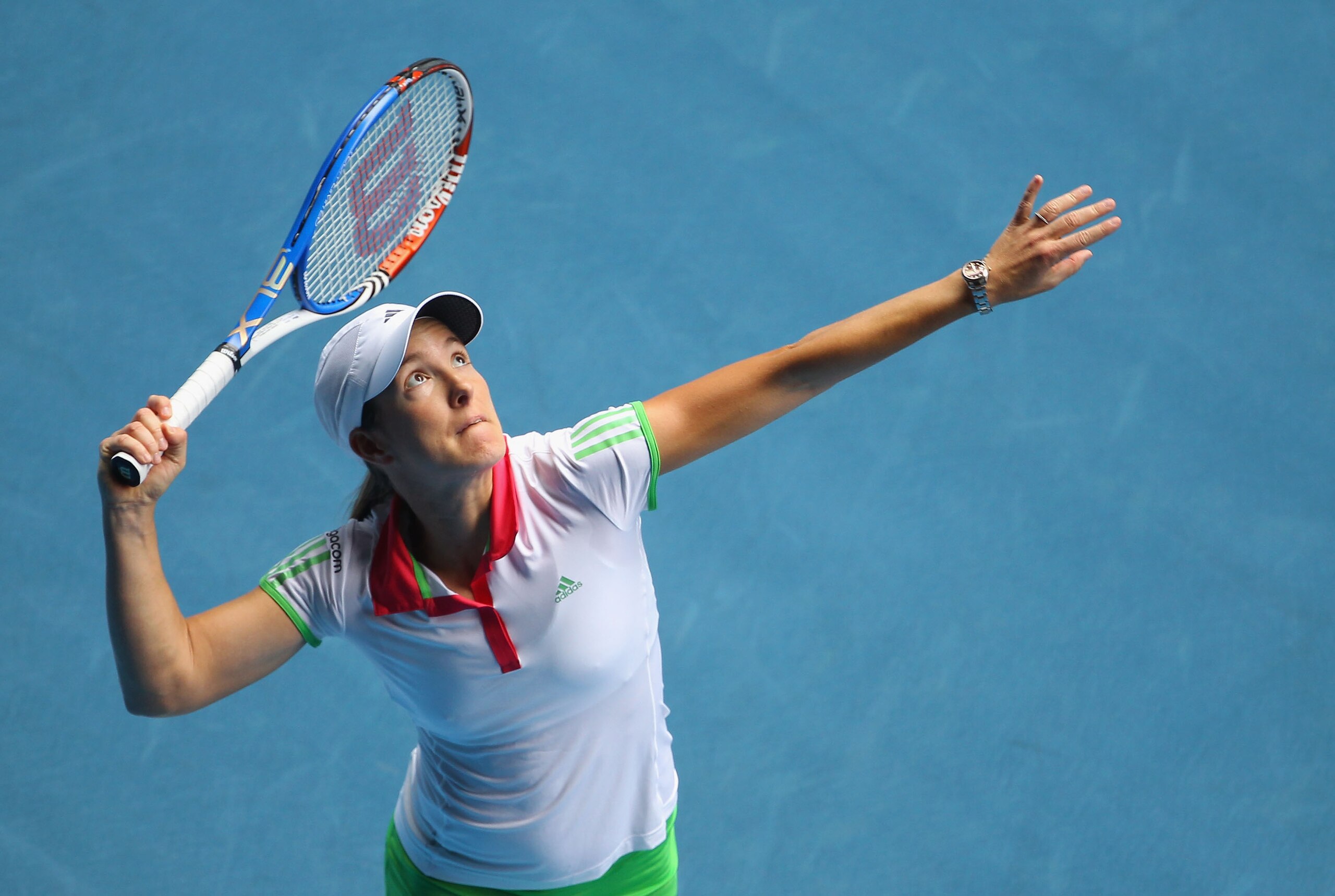 MELBOURNE, AUSTRALIA - JANUARY 19:  Justine Henin of Belgium serves in her second round match against Elena Baltacha of Great Britain during day three of the 2011 Australian Open at Melbourne Park on January 19, 2011 in Melbourne, Australia.  (Photo by Ju