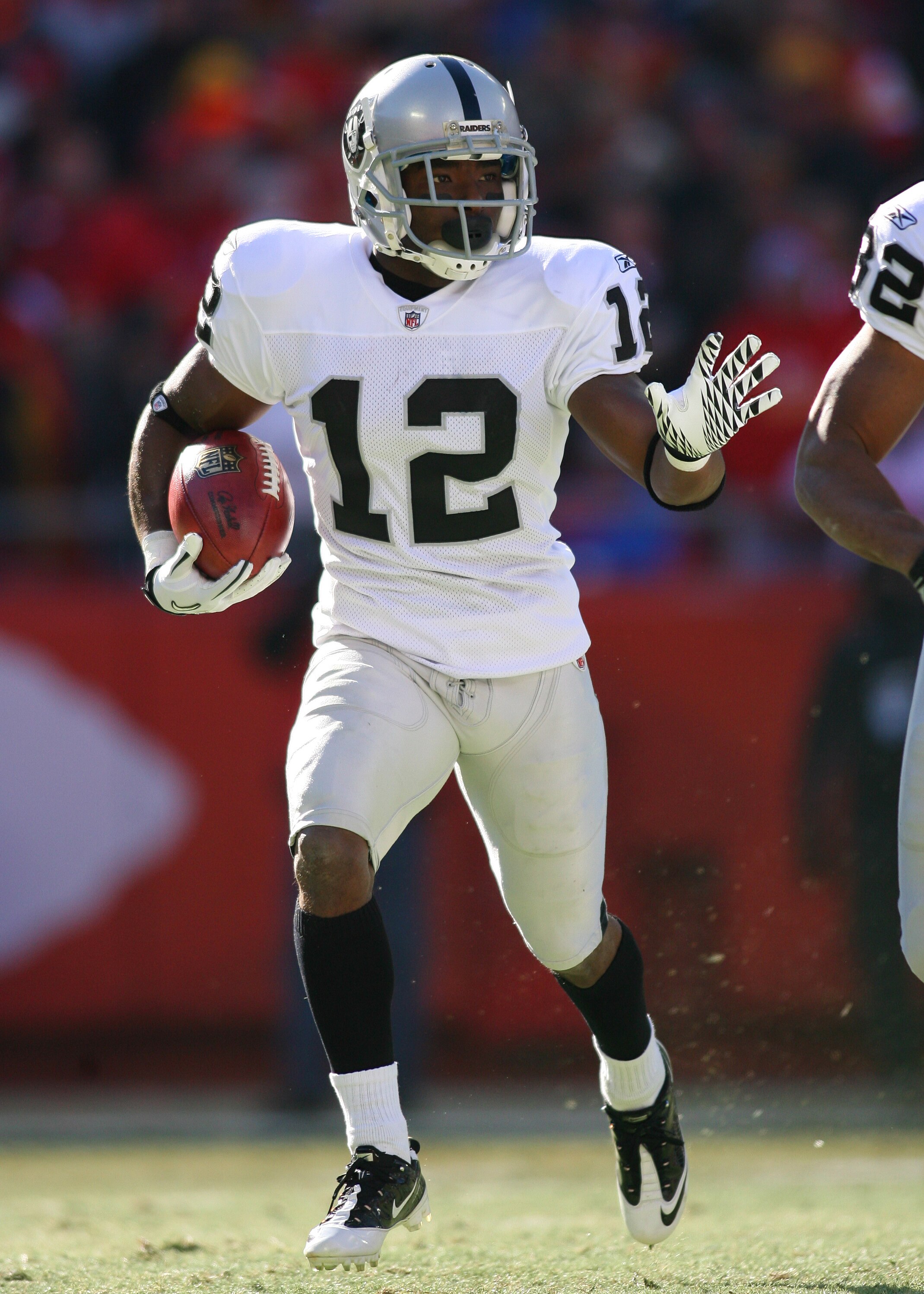KANSAS CITY, MO - JANUARY 02:  Wide receiver Jacoby Ford #12 of the Oakland Raiders returns a kickoff in a game against the Kansas City Chiefs at Arrowhead Stadium on January 2, 2011 in Kansas City, Missouri.  (Photo by Tim Umphrey/Getty Images)