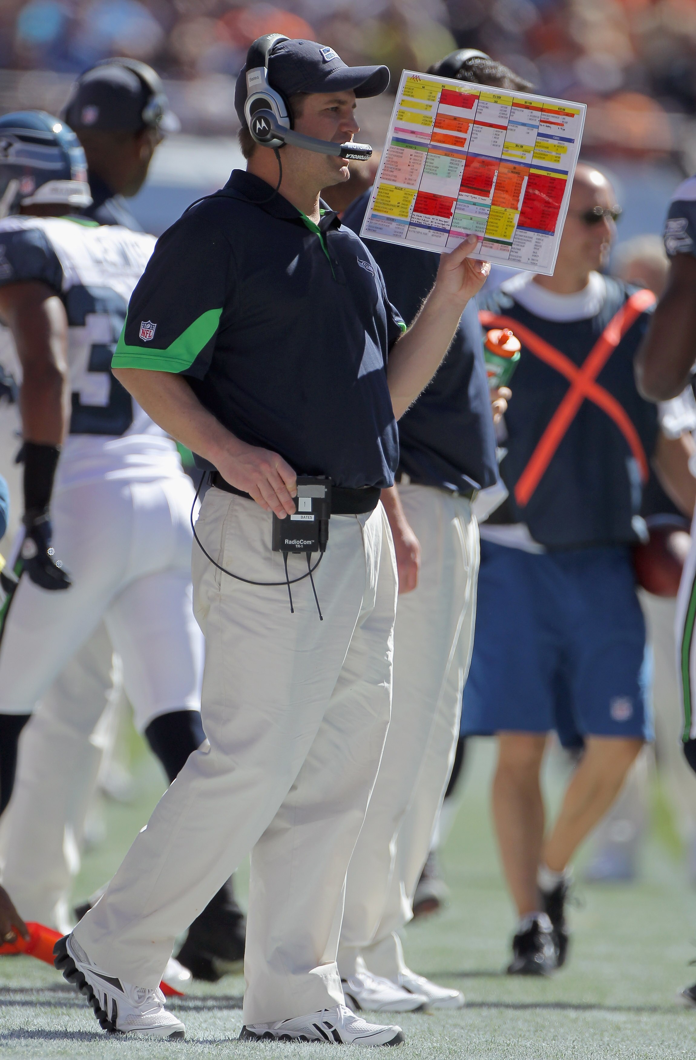 DENVER - SEPTEMBER 19:  Jeremy Bates Offensive Coordinator of the Seattle Seahawks directs his team against the Denver Broncos with a bandaged nose at INVESCO Field at Mile High on September 19, 2010 in Denver, Colorado. The Broncos defeated the Seahawks