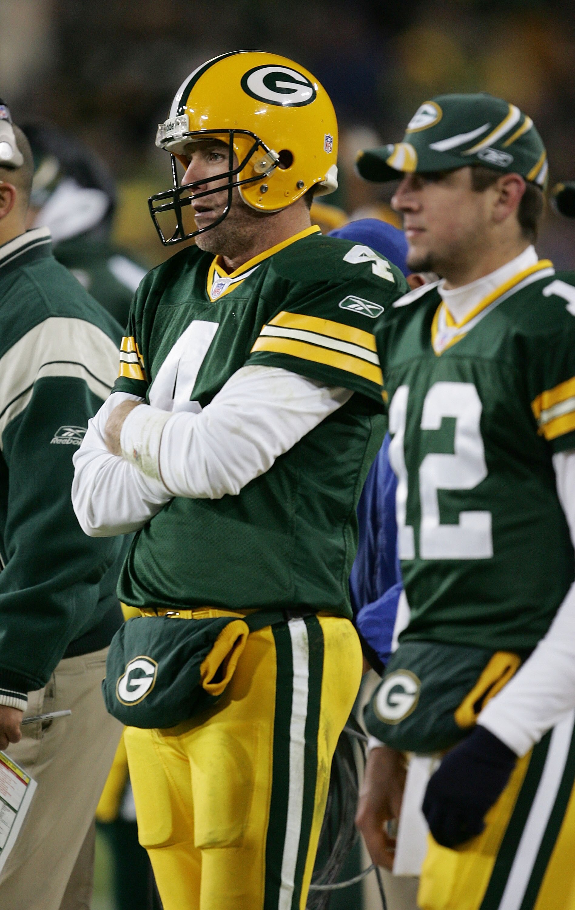 GREEN BAY, WI - NOVEMBER 6:  Quarterbacks Brett Favre #4 and Aaron Rodgers #12 of the Green Bay Packers watch the final minutes of a game against the Pittsburgh Steelers from the sideline November 6, 2005 at Lambeau Field in Green Bay, Wisconsin. The Stee